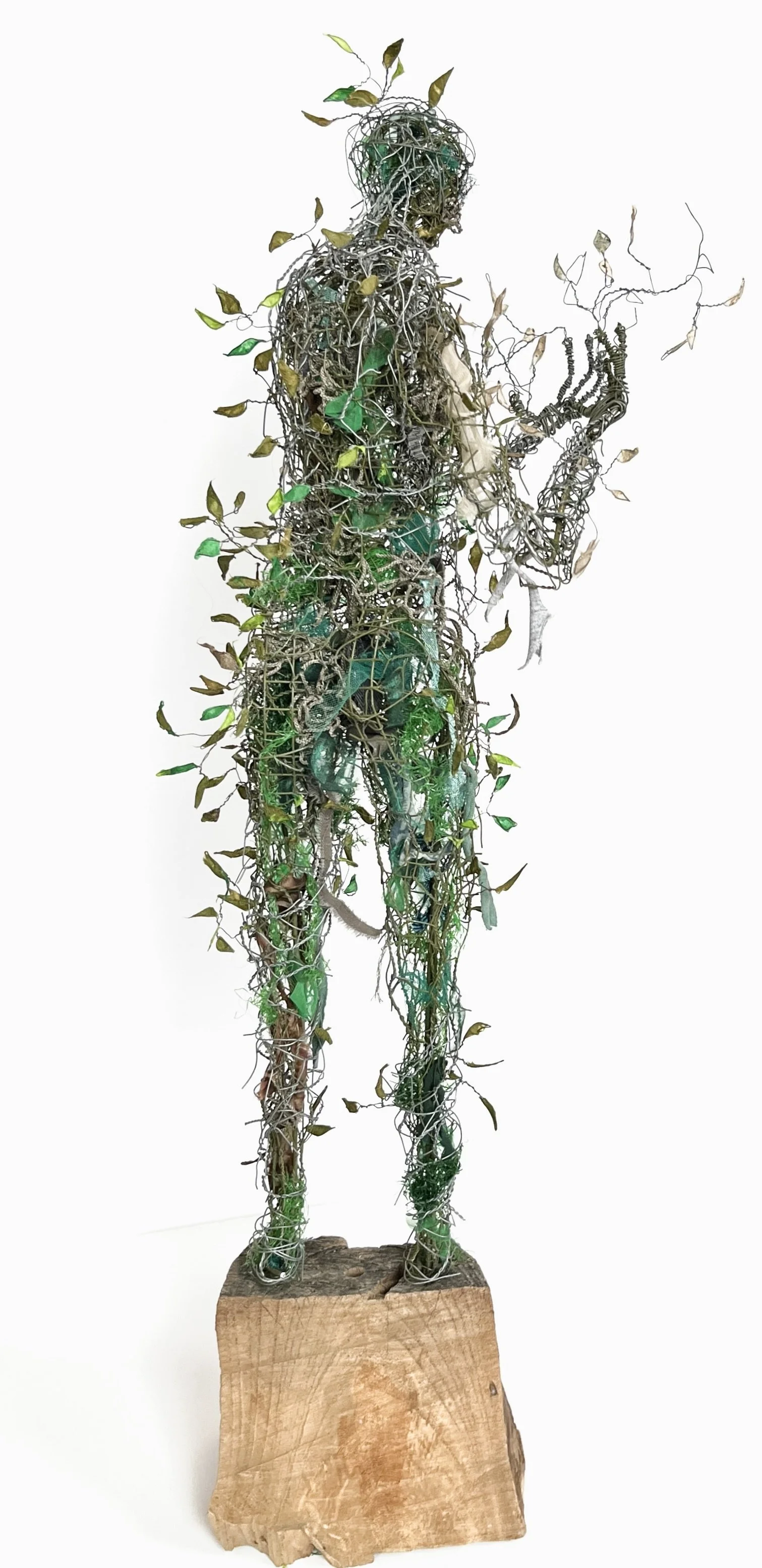 Green Man Turning, 2025, wire, fabric, paper, net, 29" x 9" x 12"