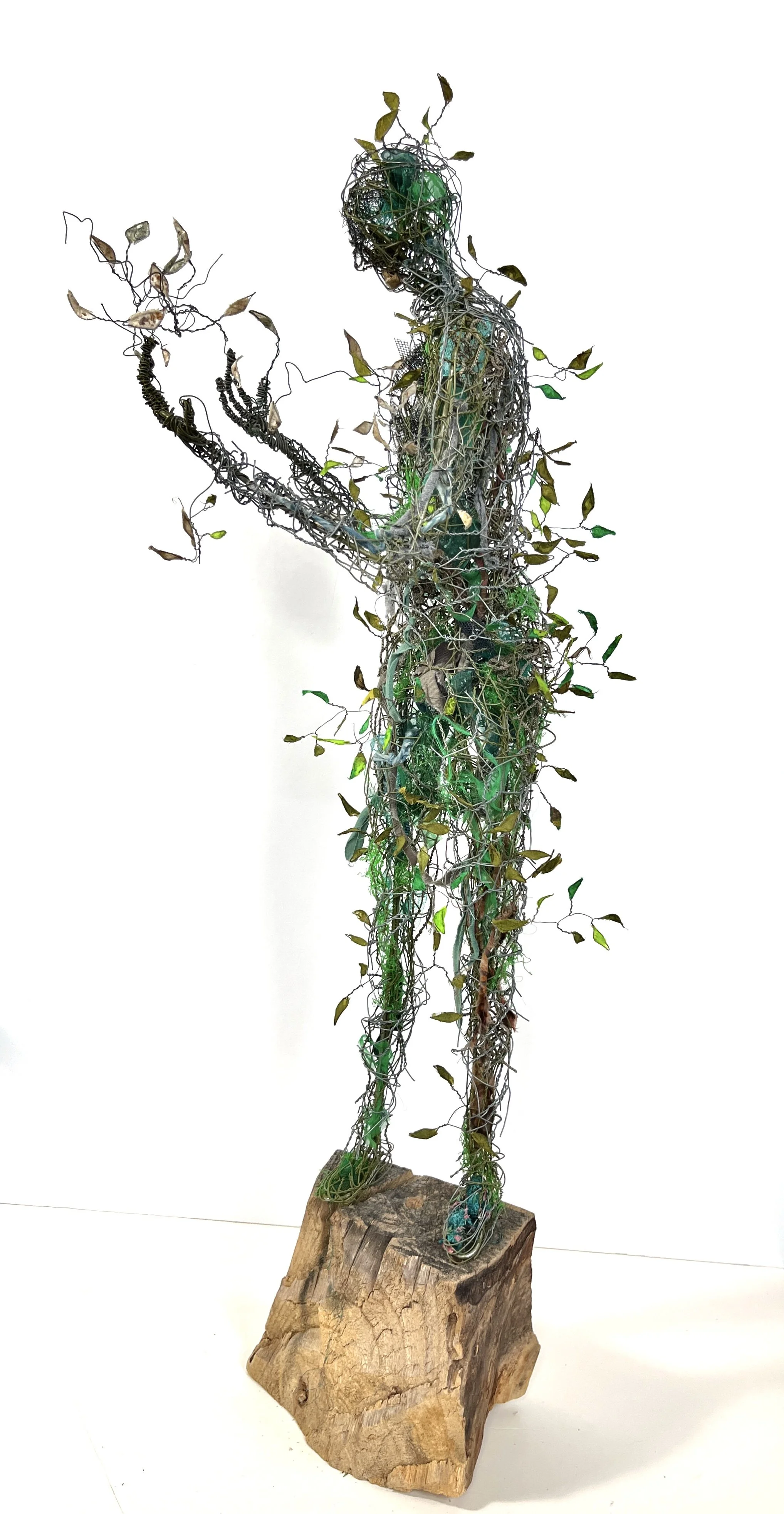 Green Man Turning, 2025, wire, fabric, paper, net, 29" x 9" x 12"