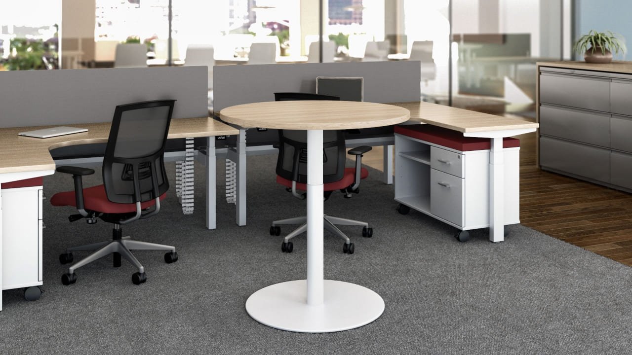 Penumatic height adjustable round meeting table in high position