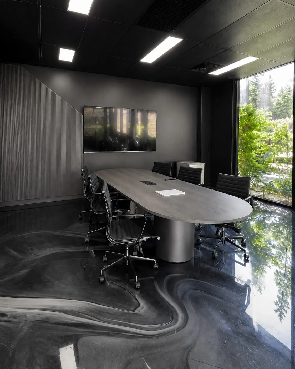 Black drum base meeting table with black eames meeting swivel base chairs