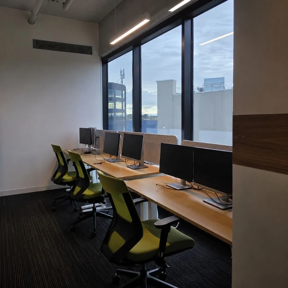 Oak sit stand desk, acoustic panels, green nova ergonomic chair