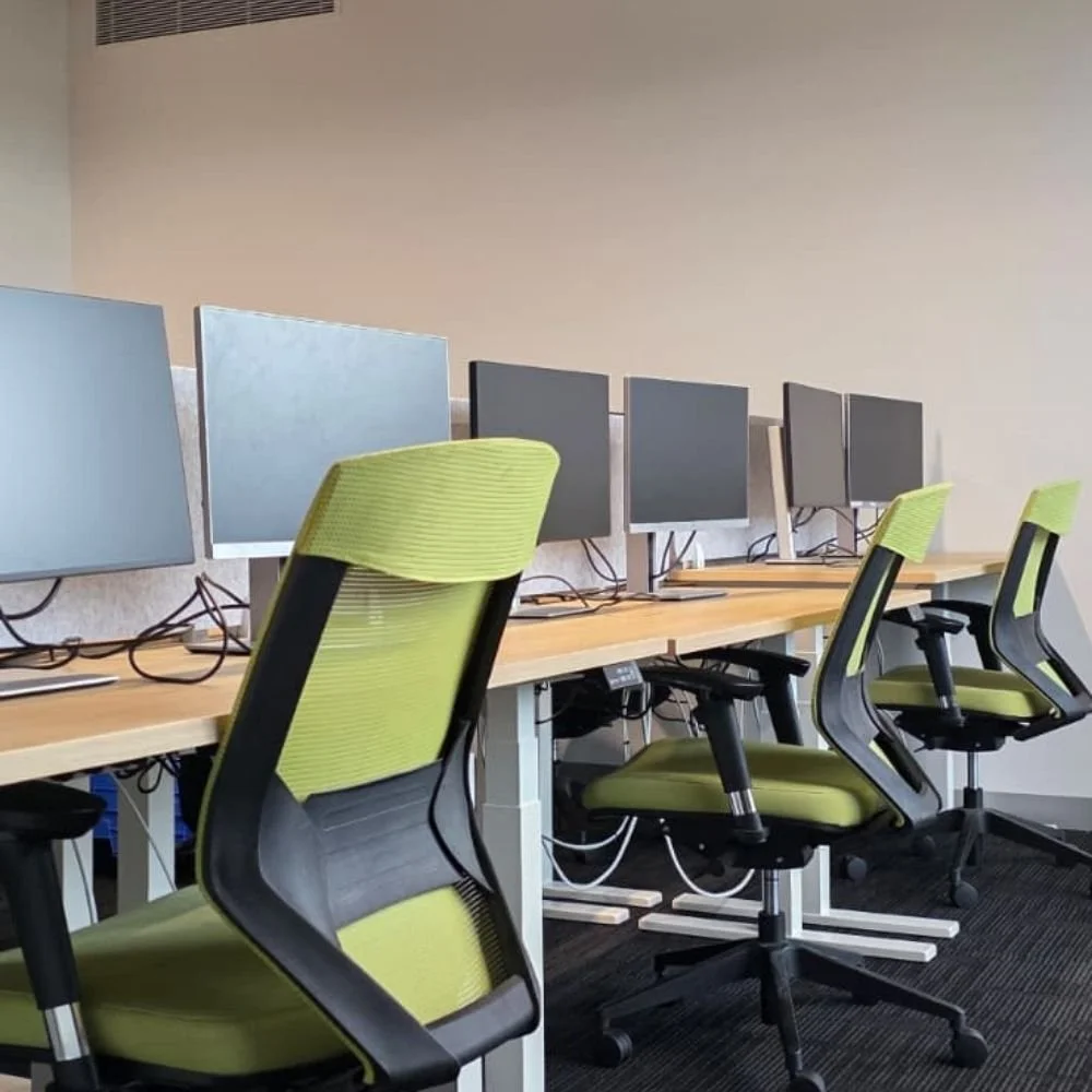 Oak sit stand desk with green nova ergonomic chair