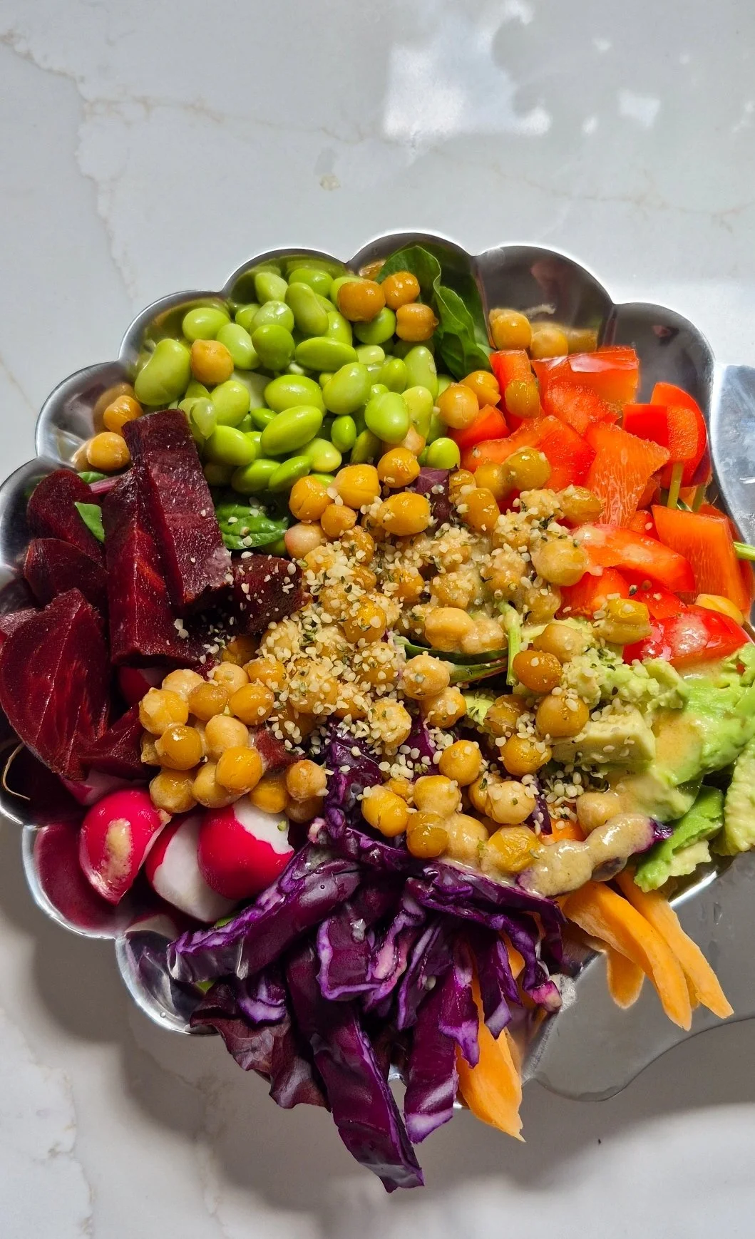 Rainbow nourish bowl with a tahini-lemon dressing