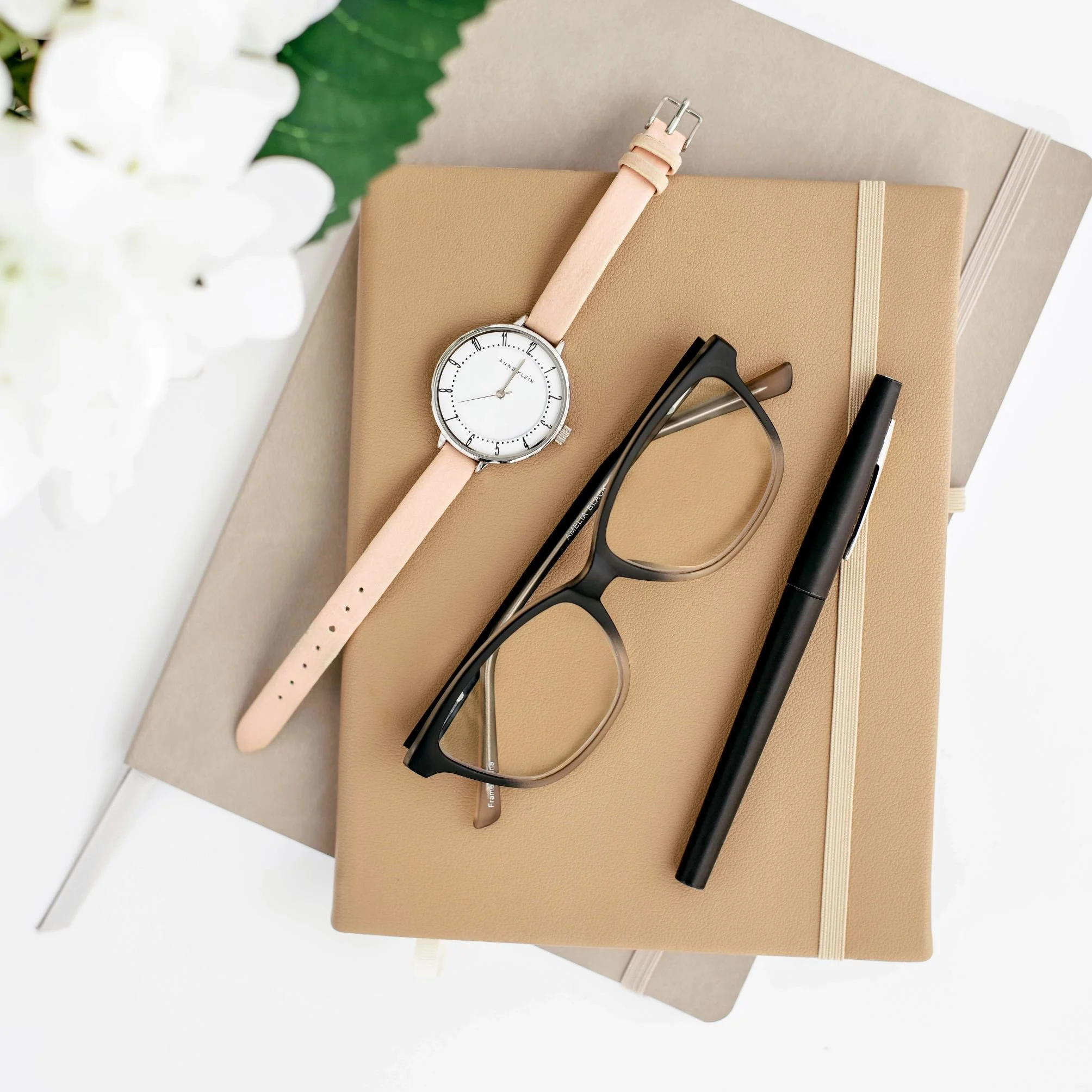 Notepad and glasses for planning a Pinterest marketing strategy for eCommerce shops
