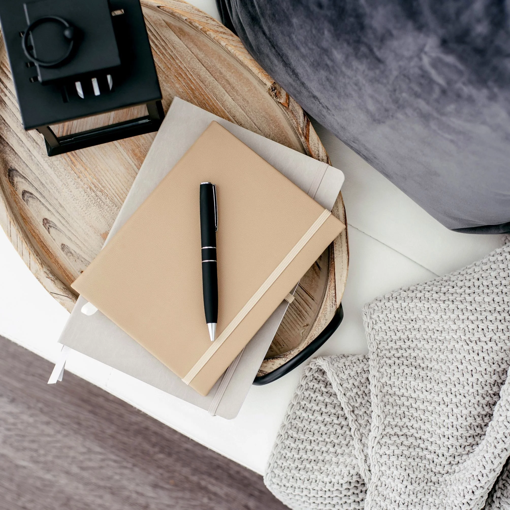 Notepad and pen for planning a Pinterest marketing strategy for eCommerce shops
