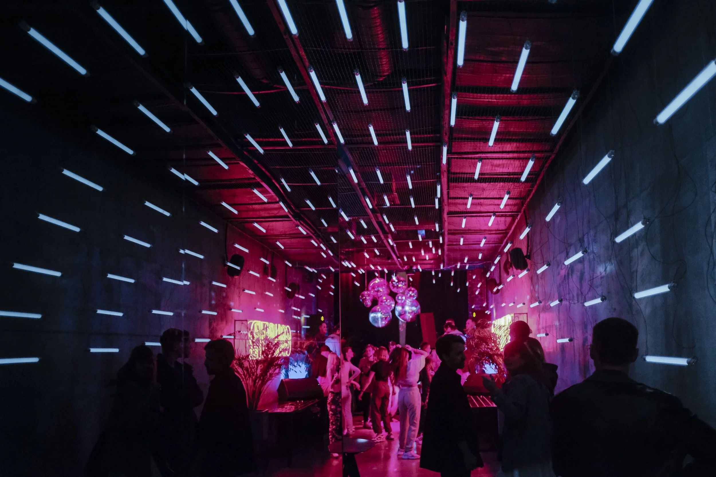 chicago nightclub. party with fun lights. event with discoballs and people dancing. a night out in chicago.