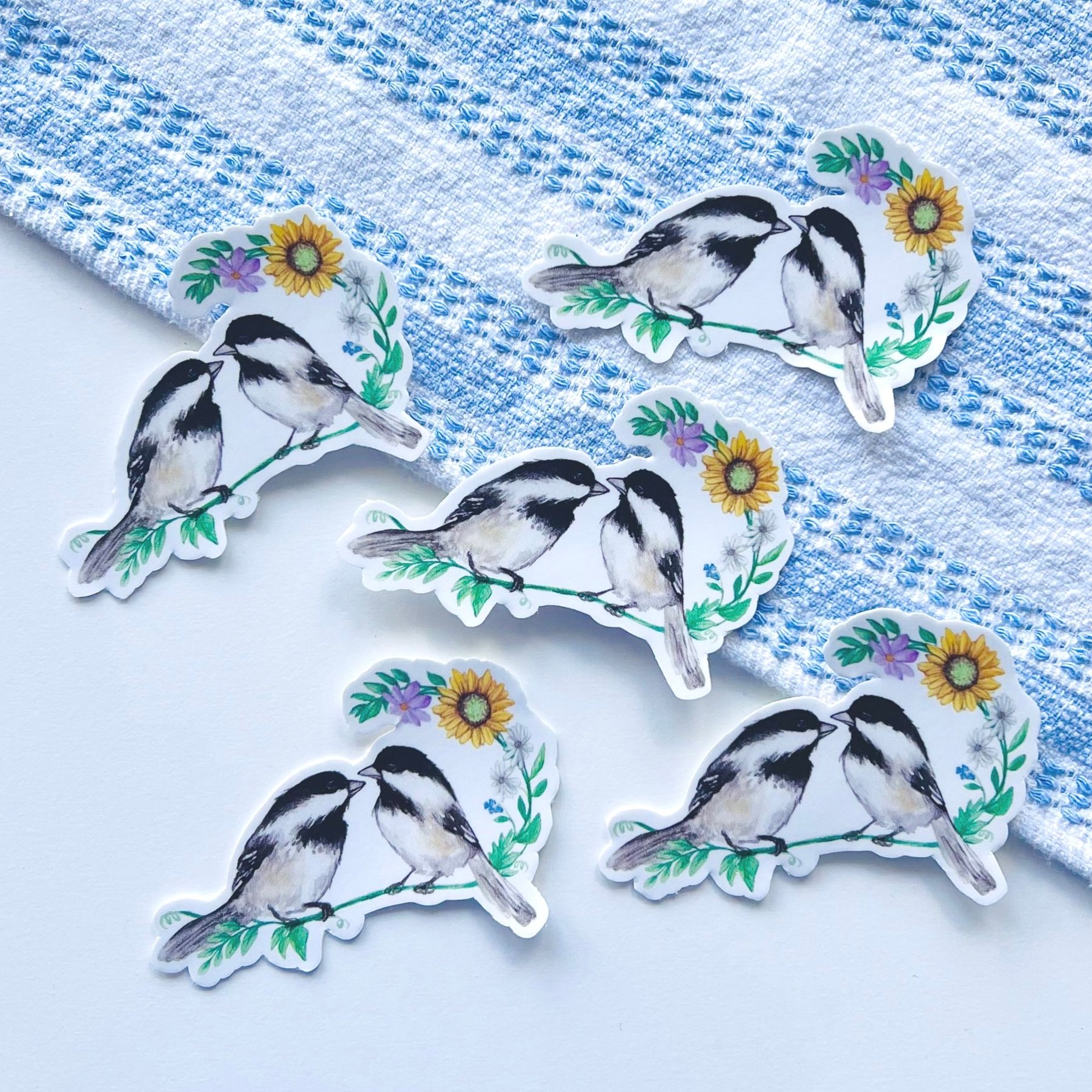 Multiple Watercolor Chickadees sitting on a floral branch stickers