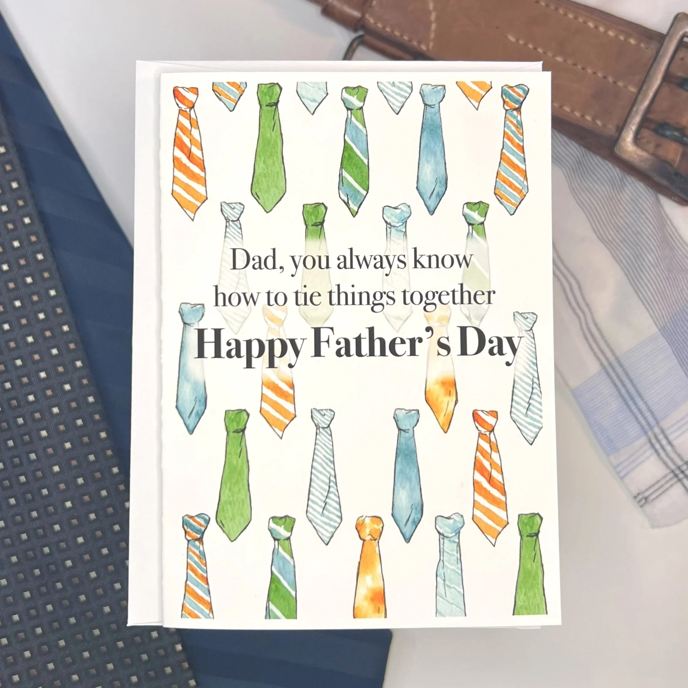 Watercolor Father's Day Necktie card. The front of the card says, "Dad, you always know how to tie things together. Happy Father's Day!"