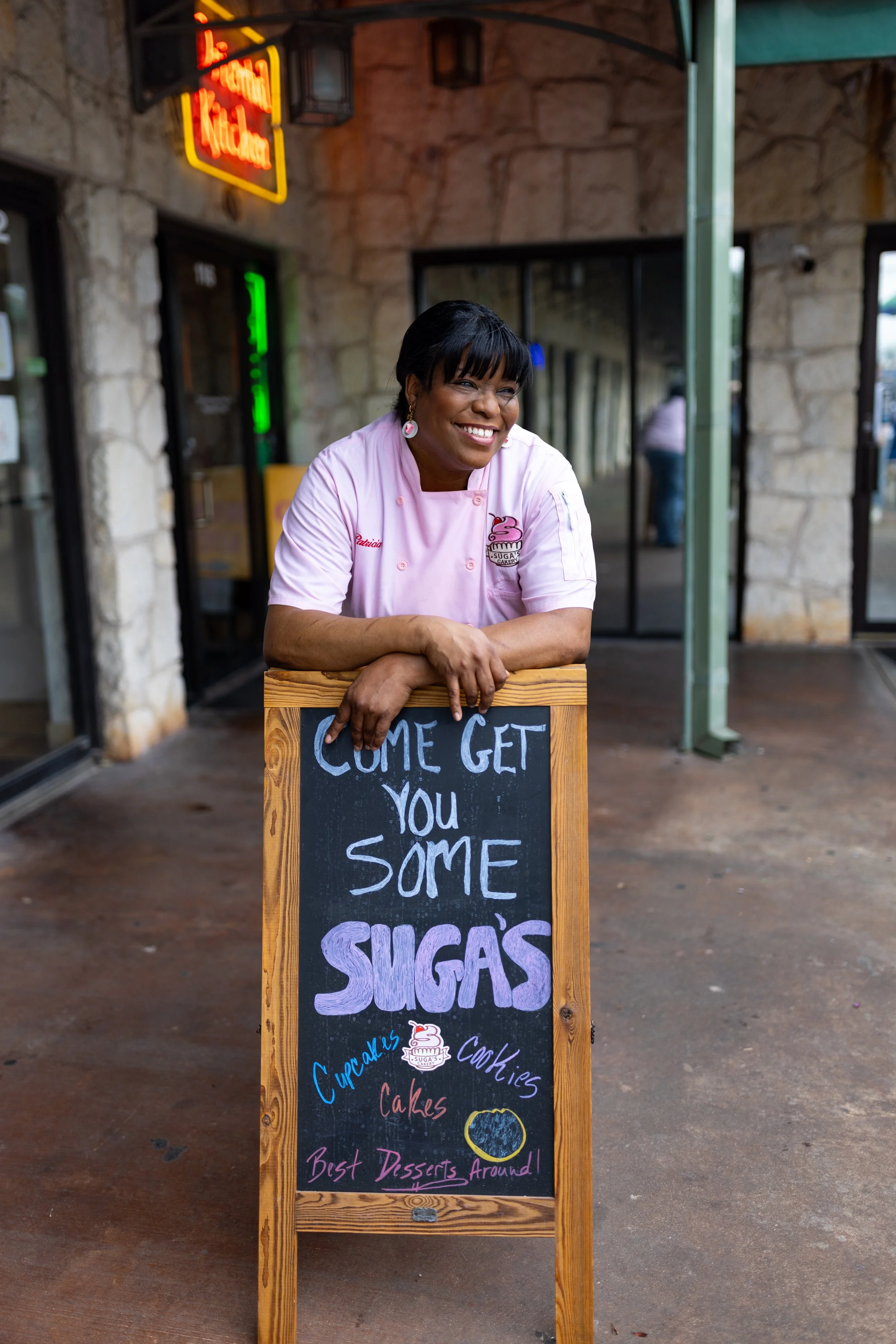 Patricia with sign.jpg