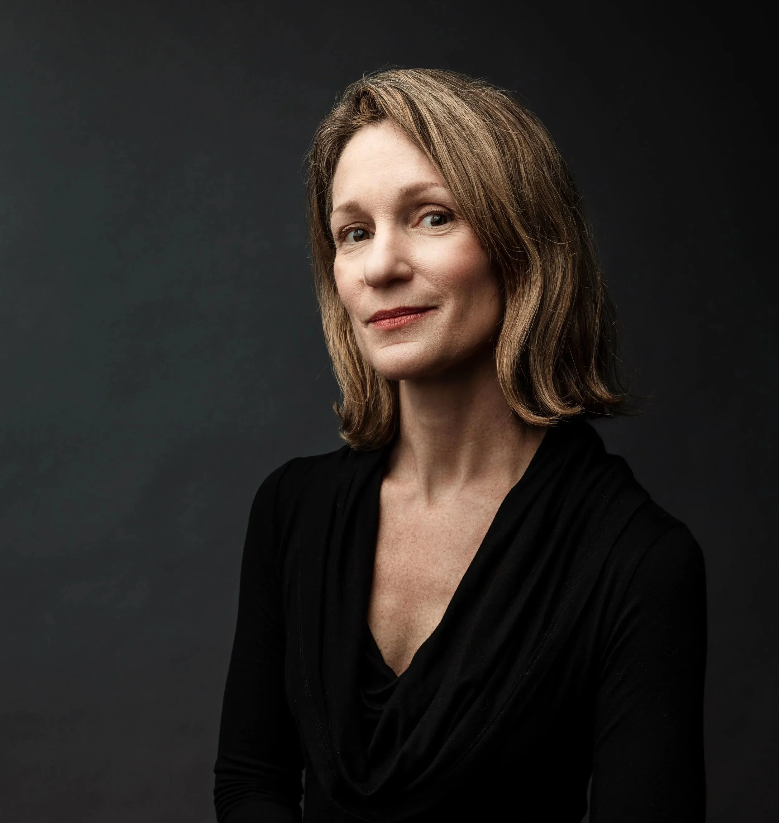 Photo of author Melissa Scott Sinclair — brunette woman with slight smile