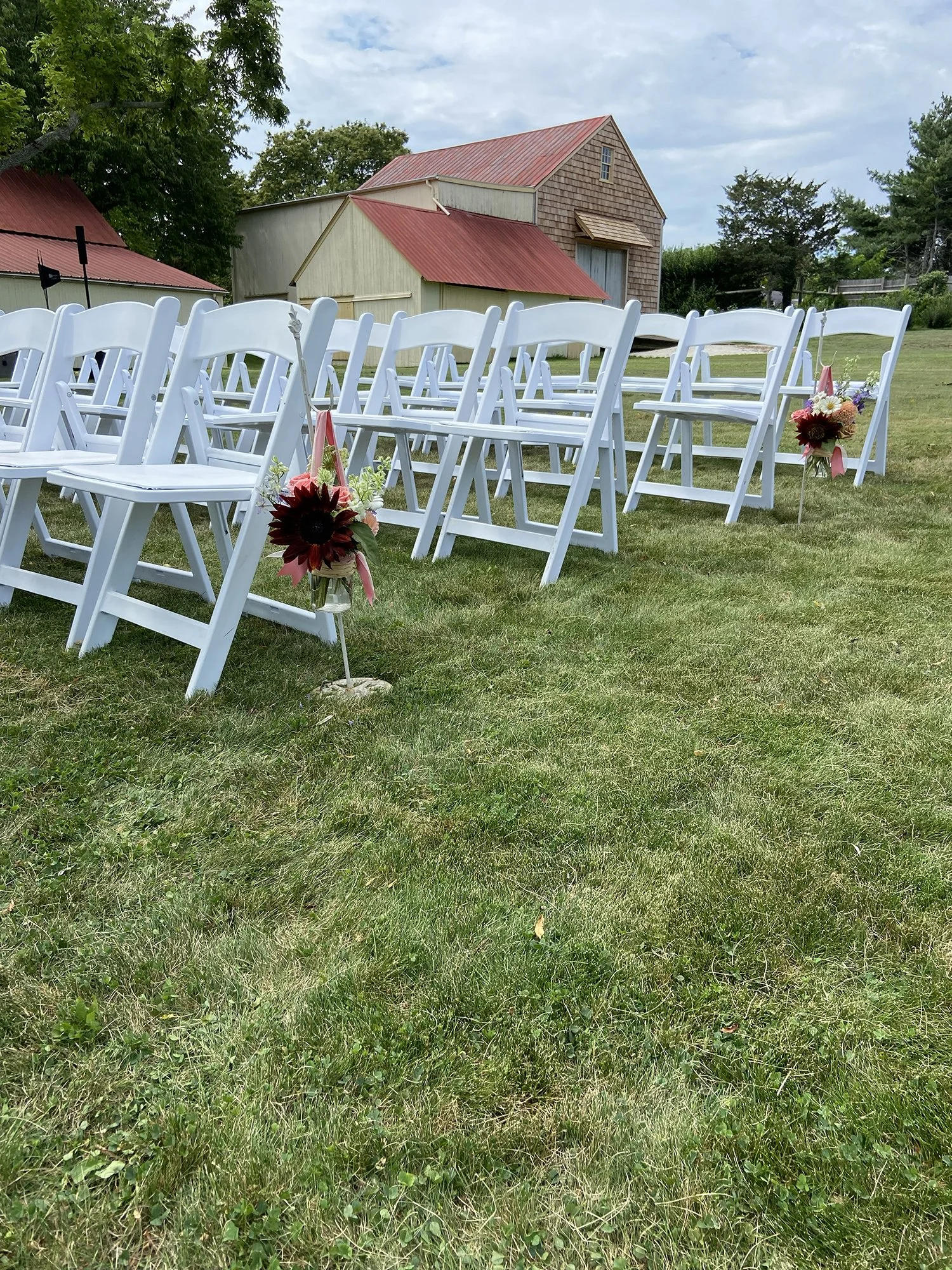 This bride chose to set up her ceremony seating behind the barns at Salt Air Farm.jpg
