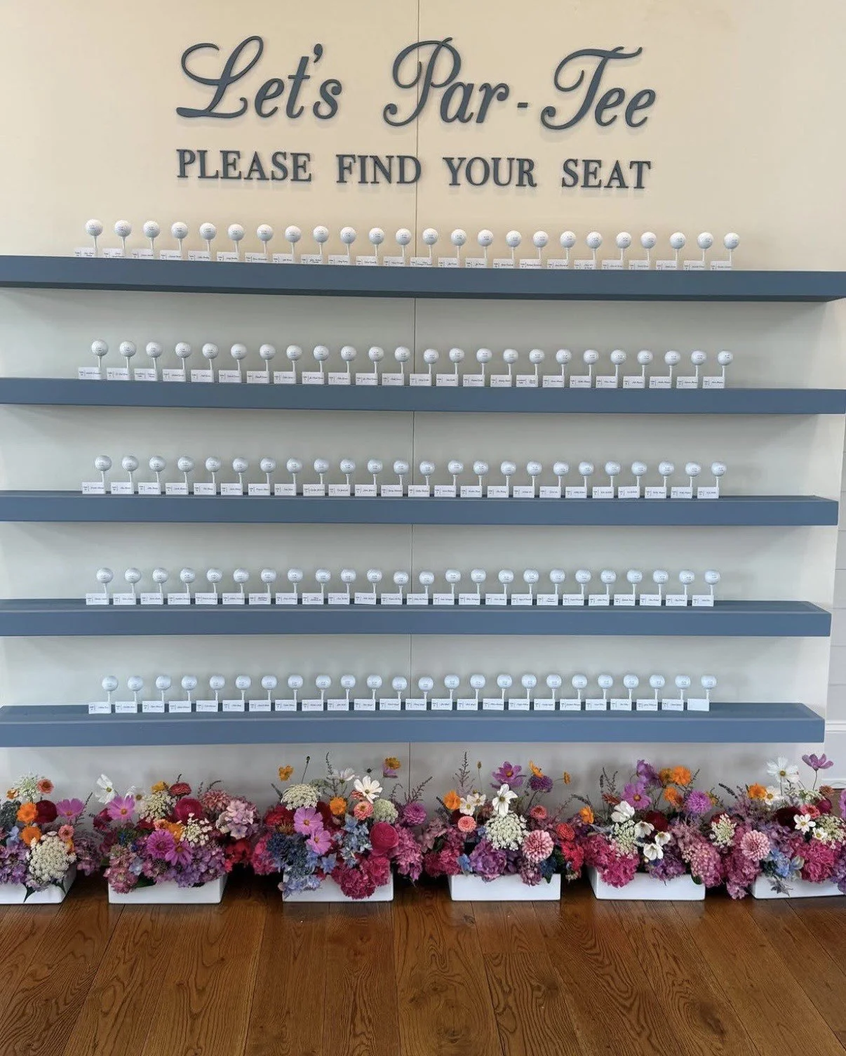 Florals for golf theme seating assignment display.jpg