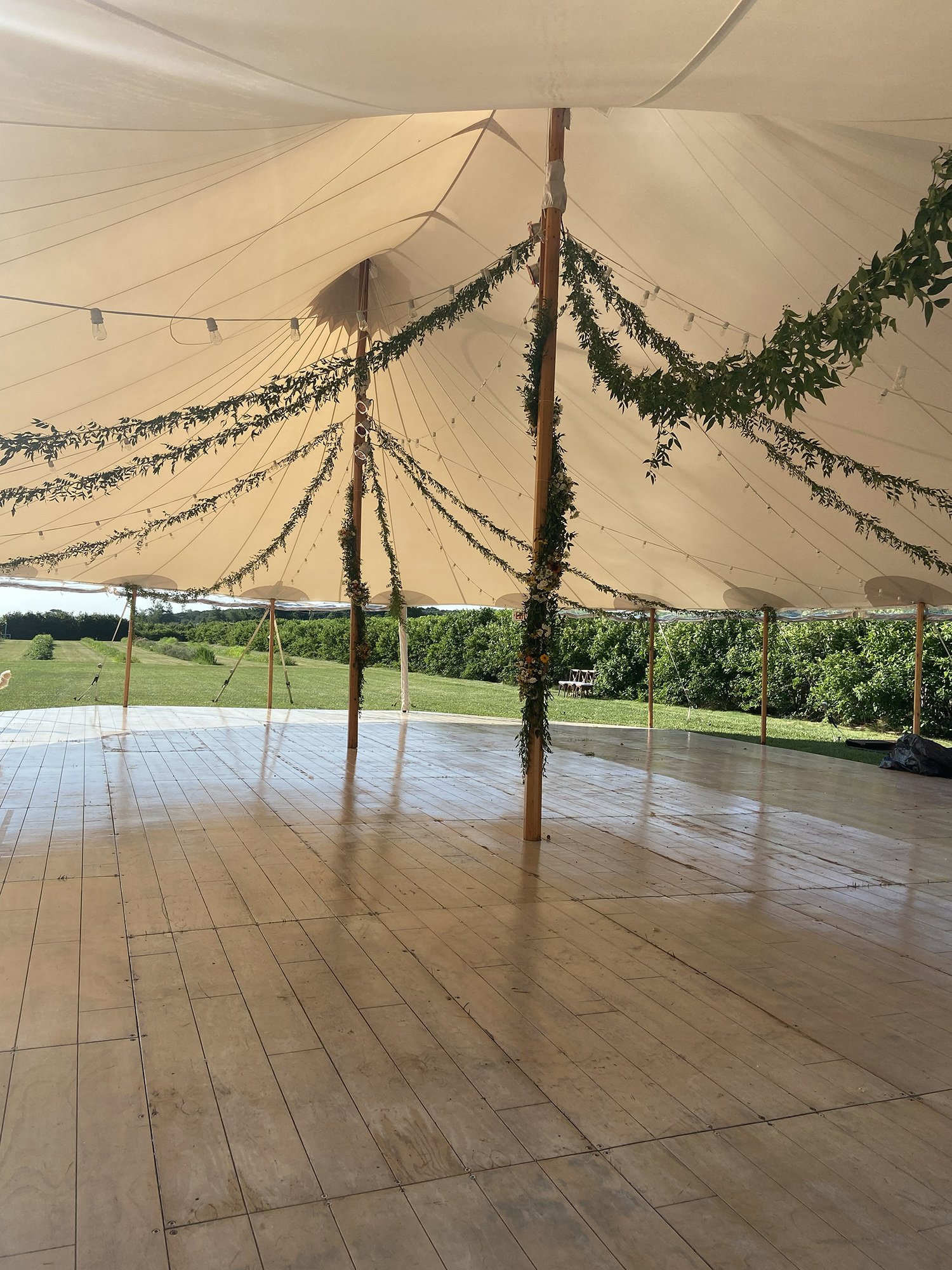 Setting up tent garlands.jpg