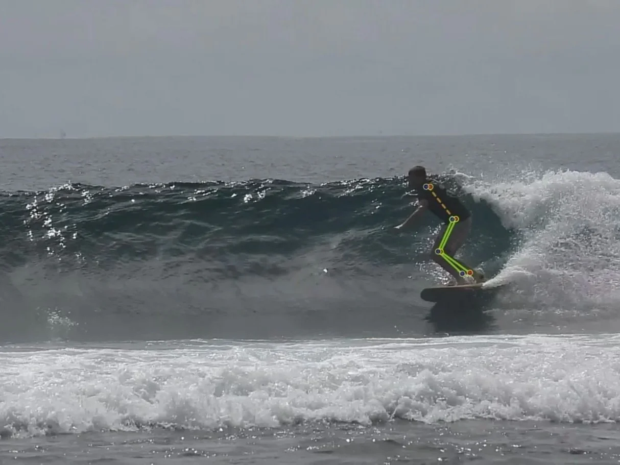 Person riding a wave on a surfboard in the ocean during daytime.