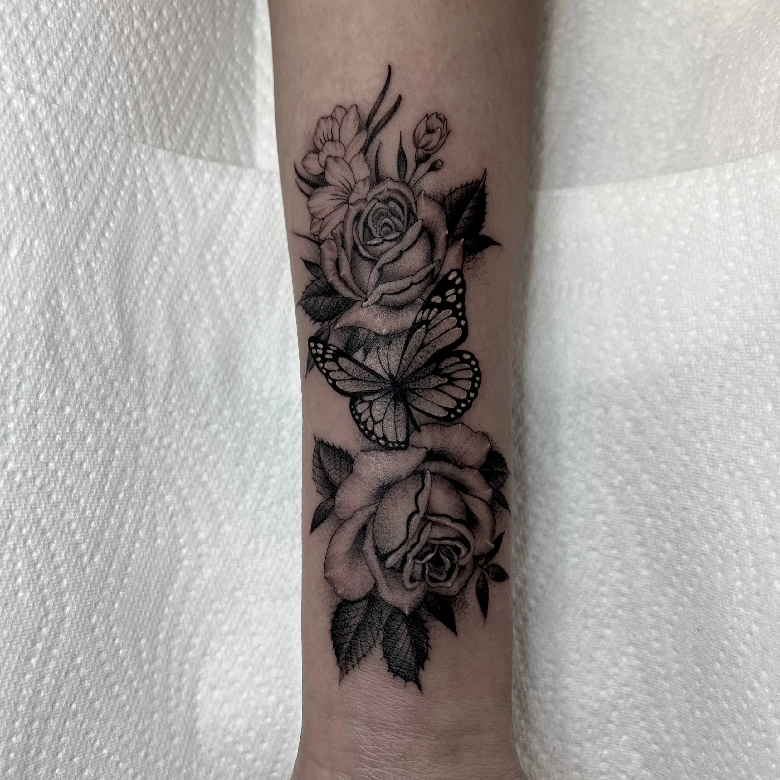Fineline rose black and grey tattoo