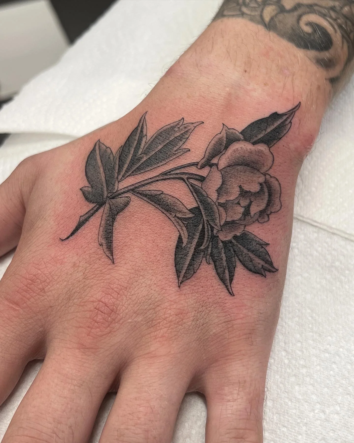 Peony fineline black  and grey hand tattoo