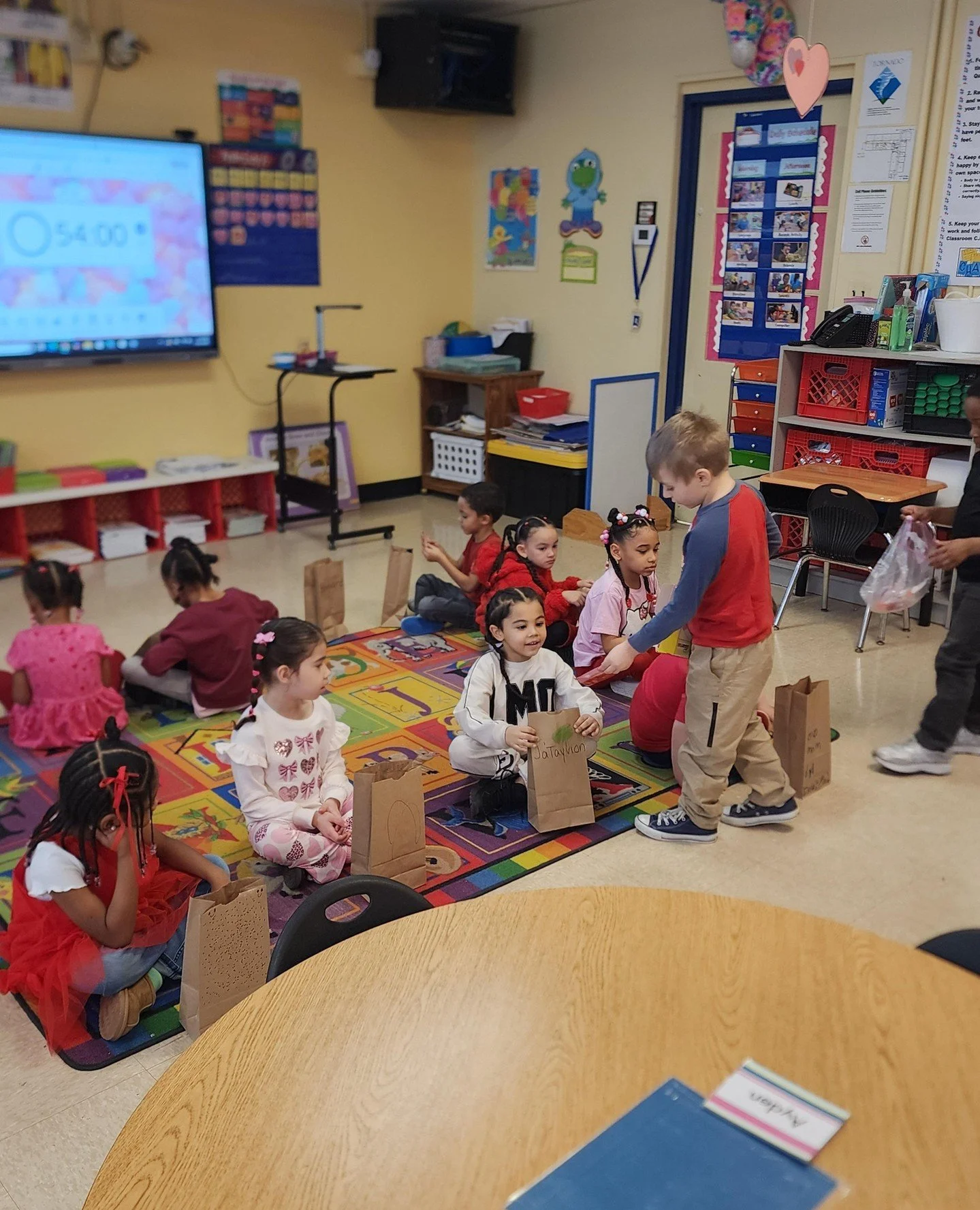 Little hands, big hearts! 💌 Kindergarteners spread kindness and smiles while sharing their Valentines.