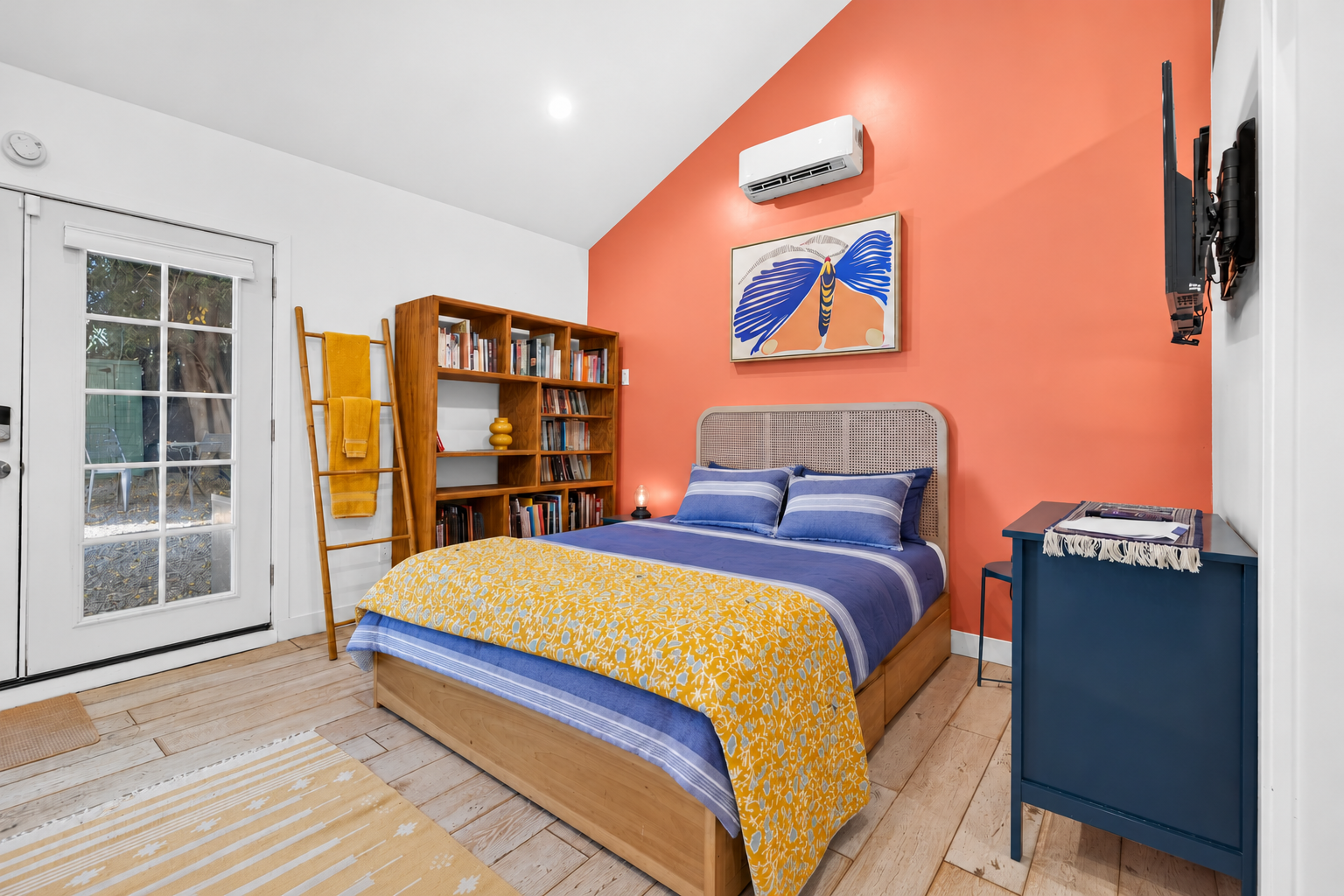 Cozy Boho Bedroom with Coral Accent Wall.png