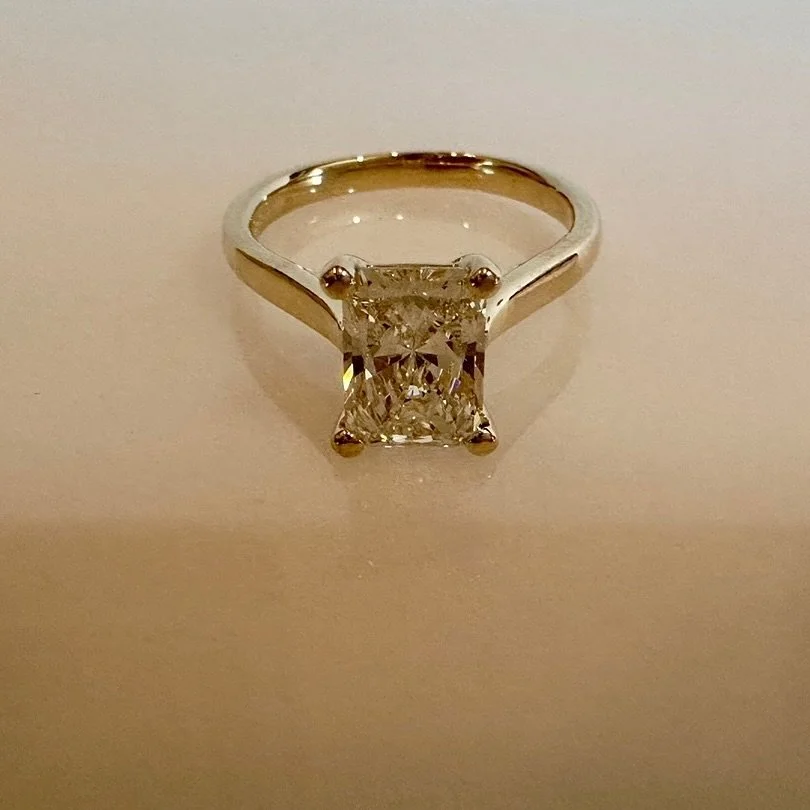 We&rsquo;re showcasing our beautiful Radiant Cut Diamond set in a classic 14KT Yellow Gold band - I am sure she will say yes!💍
⠀⠀⠀⠀⠀⠀⠀⠀⠀
Handcrafted &amp; Designed in Texas since 1991💎
⠀⠀⠀⠀⠀⠀⠀⠀⠀
#emstradingco #elizabethsoechting #personaljeweler #s
