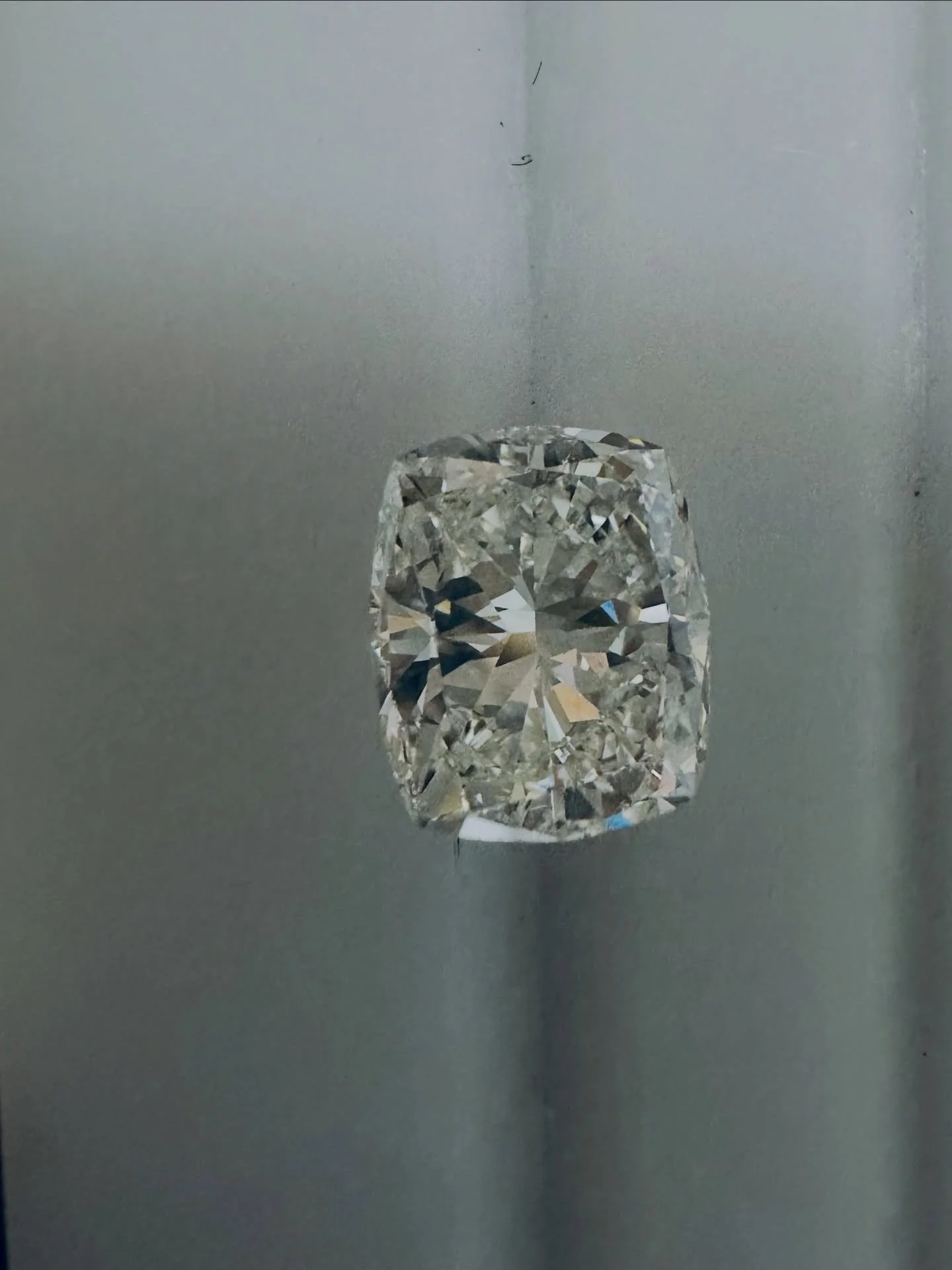 Looking for the ever popular elongated cut diamond? We have just the thing! Featuring a lovely 2.04CT beautiful elongated cushion cut diamond- it just glows with radiance! We created a perfect setting in a 14KT Rose Gold hidden halo diamond setting. 
