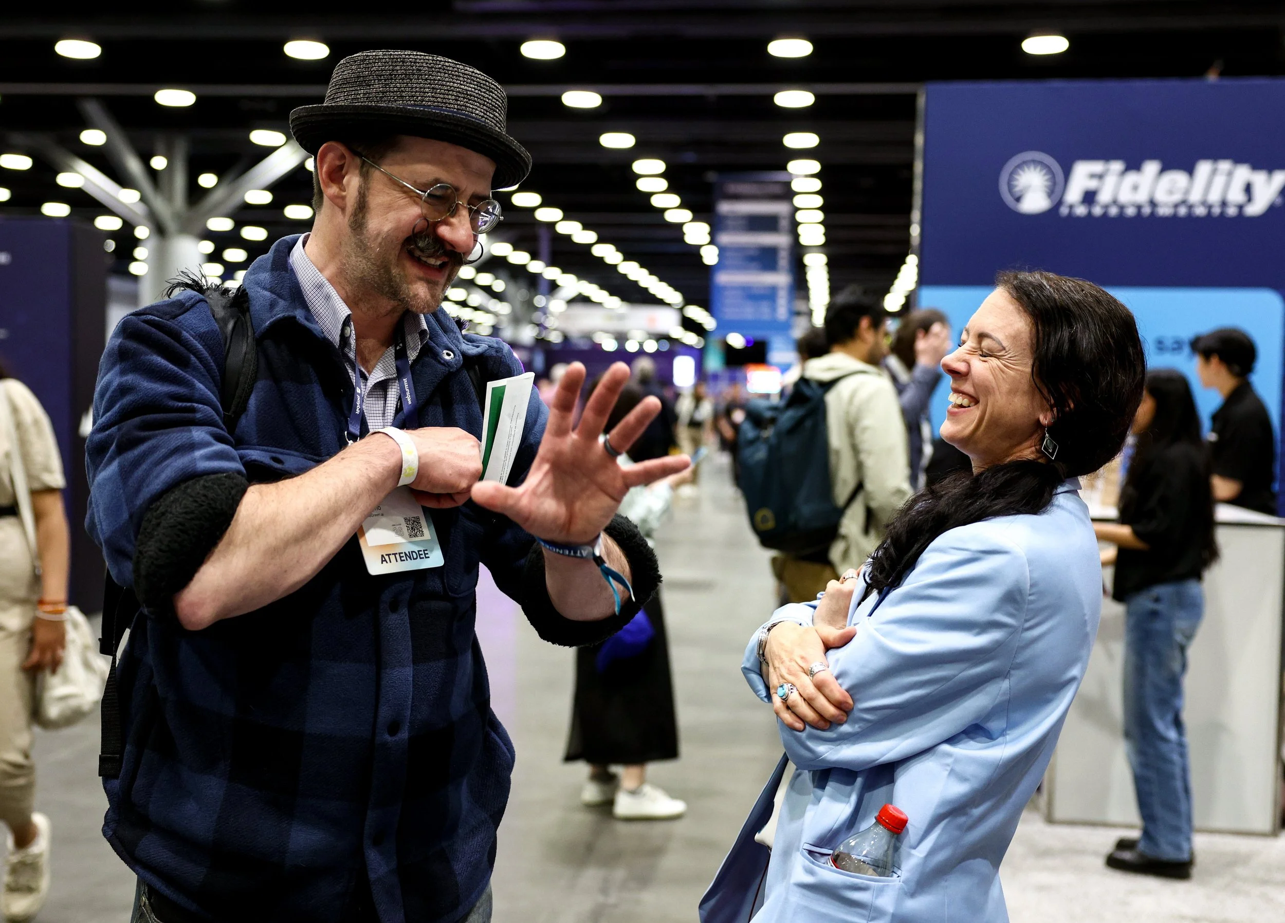 websummit-vancouver-2026-attendees-laughing-exhibition-floor-651a55.jpg
