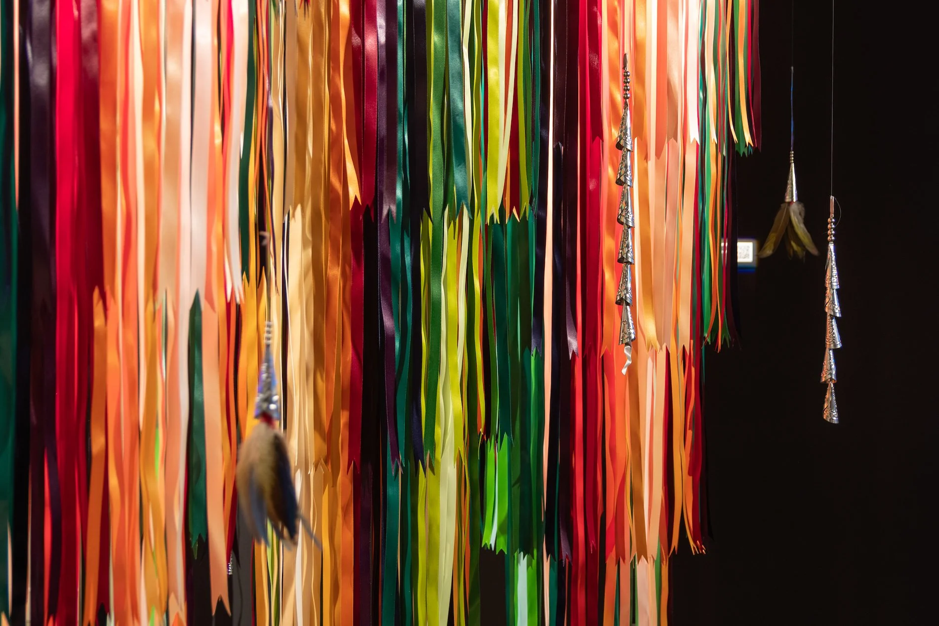 JayCee Beyale, "Aak'ei (Fall Season/Autumn)," detail 2024, Ribbon on floral metal wire wreath, Dimensions variable.