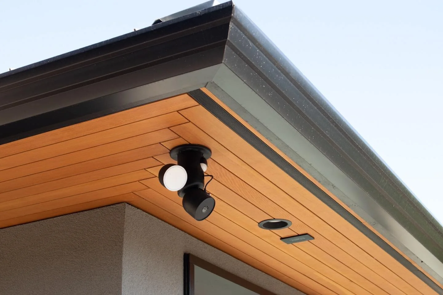 This herringbone soffit detail is the perfect eye-catching detail to place near an entryway. 
.
It also allows for a continuous vent strip along the eaves, keeping the attic dry and evenly heated to avoid ice dams and wood rot.
.
#customcarpentry #so