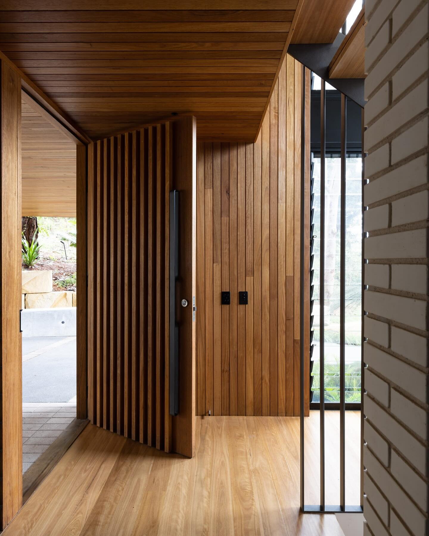 Coming or going? #wednesday  The front door is always a carefully considered part of our design. This one at our Lilli Pilli project is solid, fitting into a timber lined portico that transitions to light-filled entry hall. Builder: @mattbuildgroup P