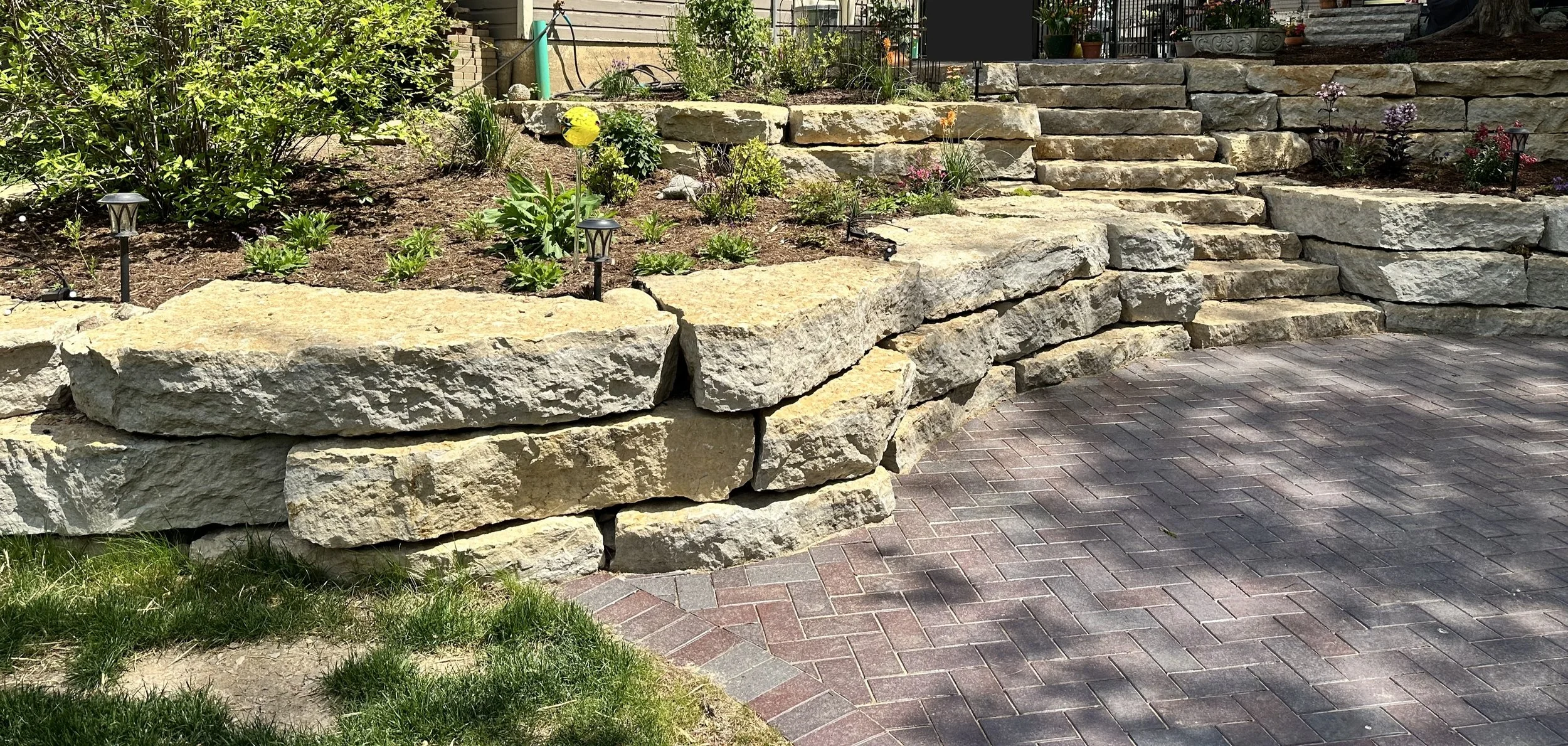 Natural Flagstone Outcropping Tiered Planting Beds and Steps