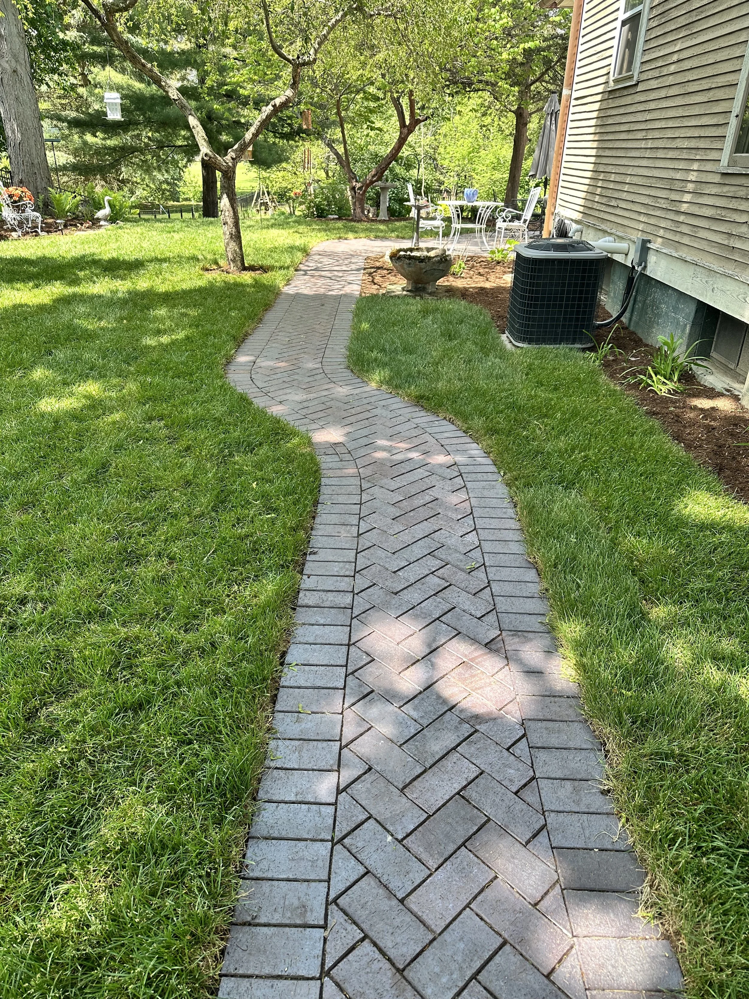 Clay brick walkway with herringbone pattern
