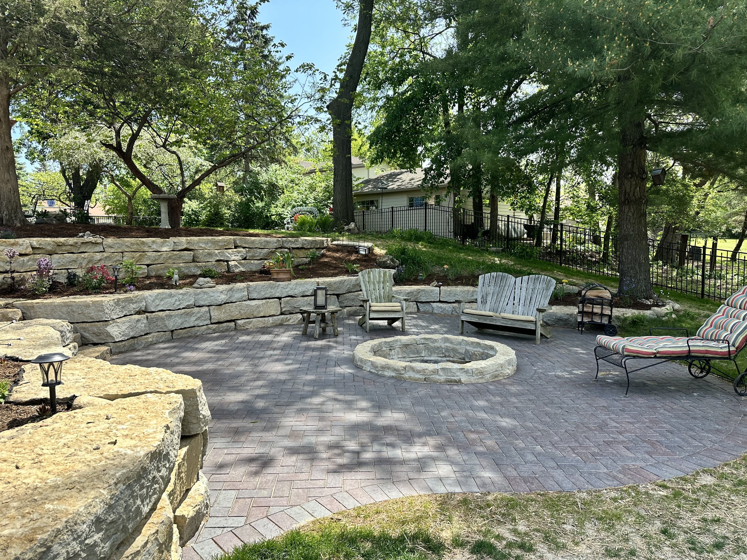Natural Flagstone Tiered Planting Beds and Clay Brick Paver Patio with Firepit