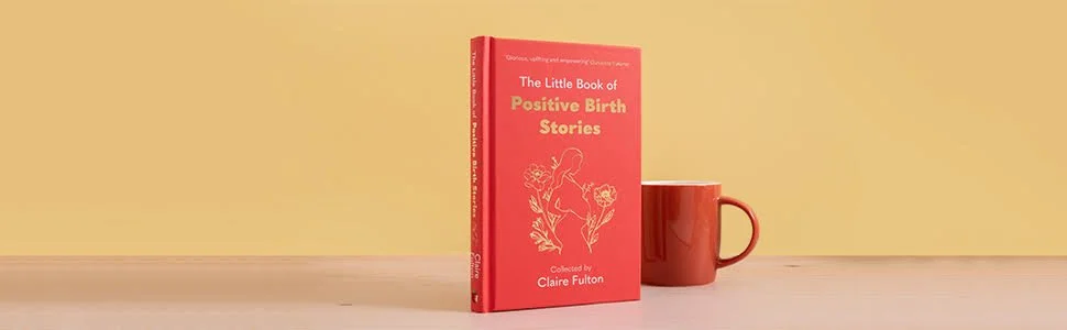 A red book titled 'The Little Book of Positive Birth Stories' and a red mug on a light-colored surface against a yellow background.