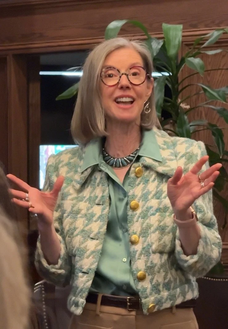 Artist Kathy Cornwell speaks to attendees about her work