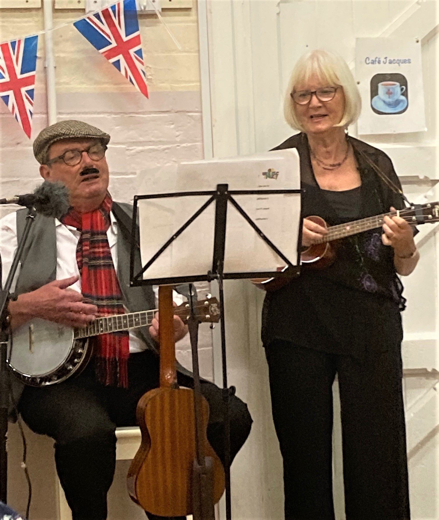 Jan and Chris James strumming in unison
