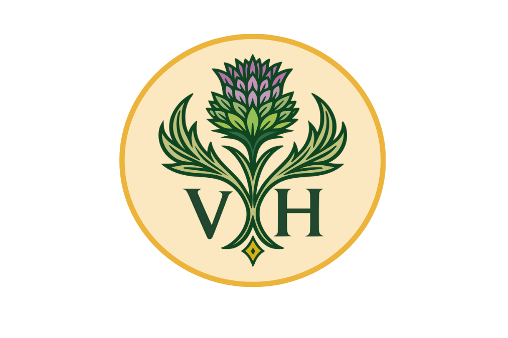 Logo featuring a purple and green thistle flower with the letters V and H beneath it, on a cream circular background with a gold border.