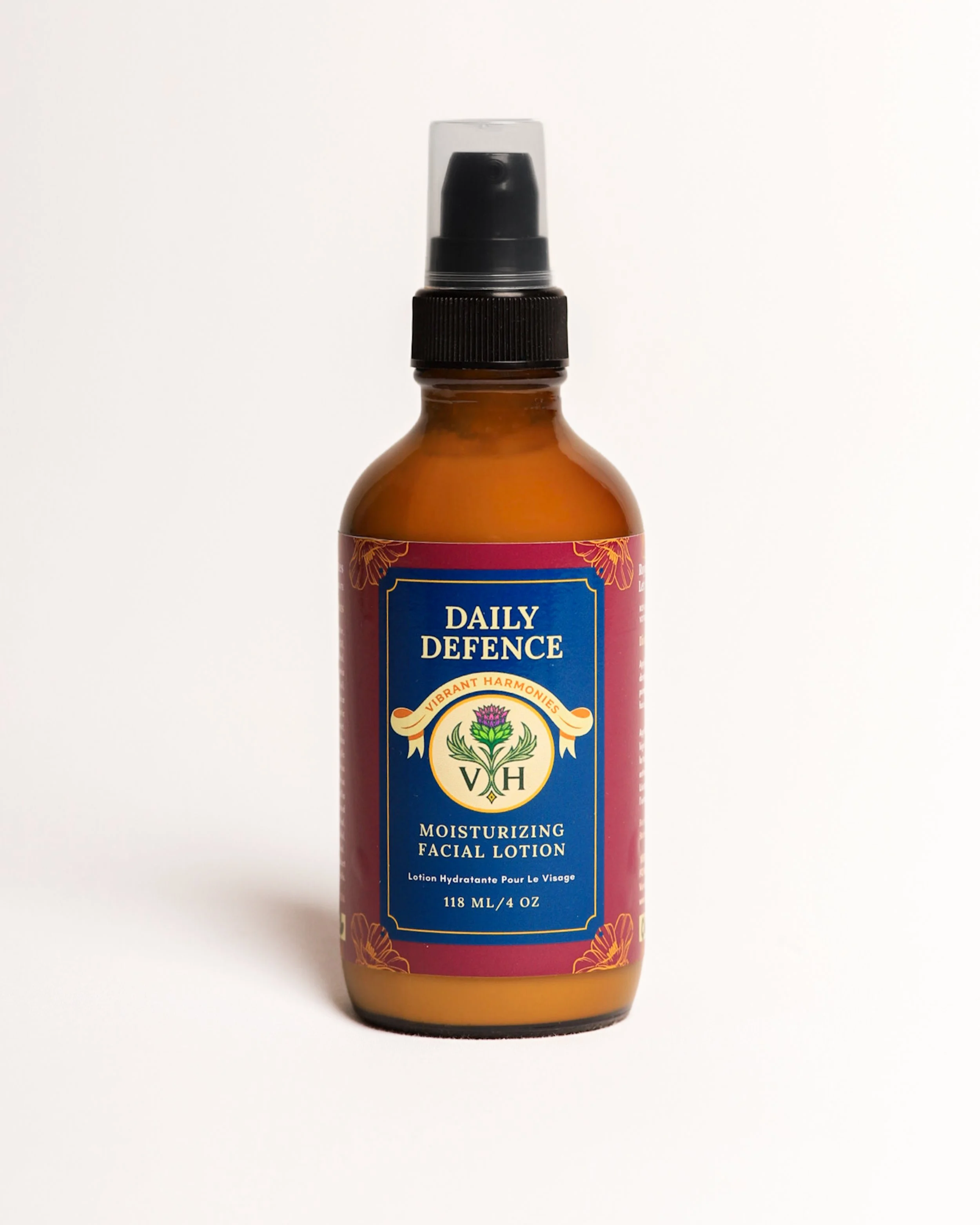A bottle of Daily Defence moisturizing facial lotion with a spray pump and a colorful label.