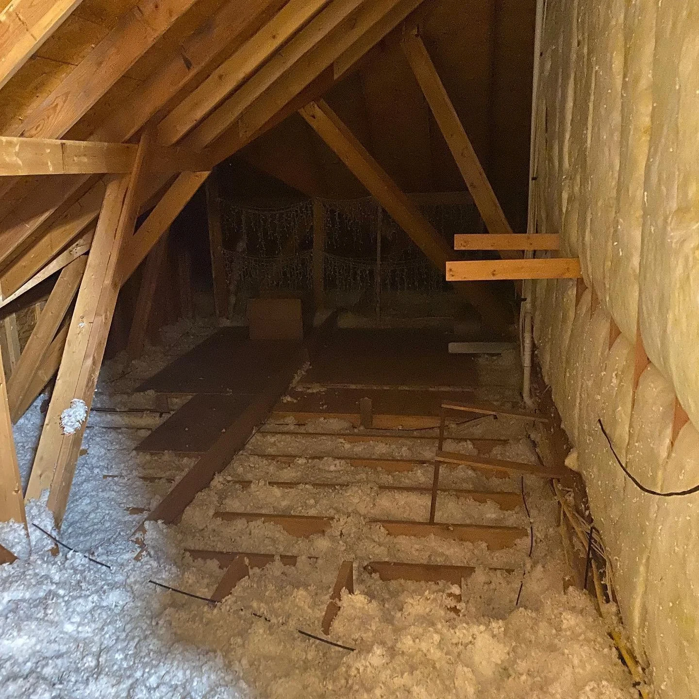 If your house is hot, or your AC is struggling to keep up this summer - read on!
-
In the first picture you can see an attic that has about 8&rdquo; of attic insulation (roughly an R19). Most municipal codes  require at minimum an R38 (about 15&rdquo