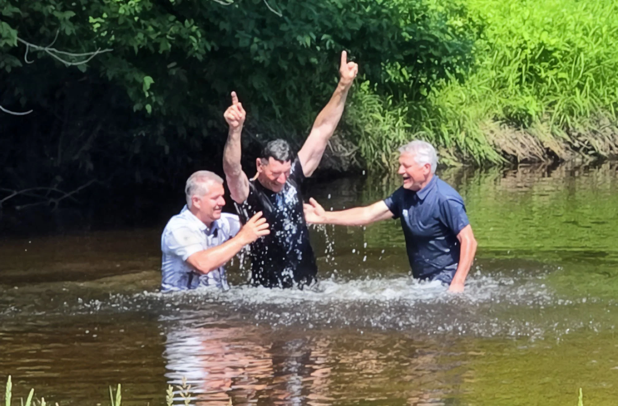 Pansy rejoices at creekside baptisms
