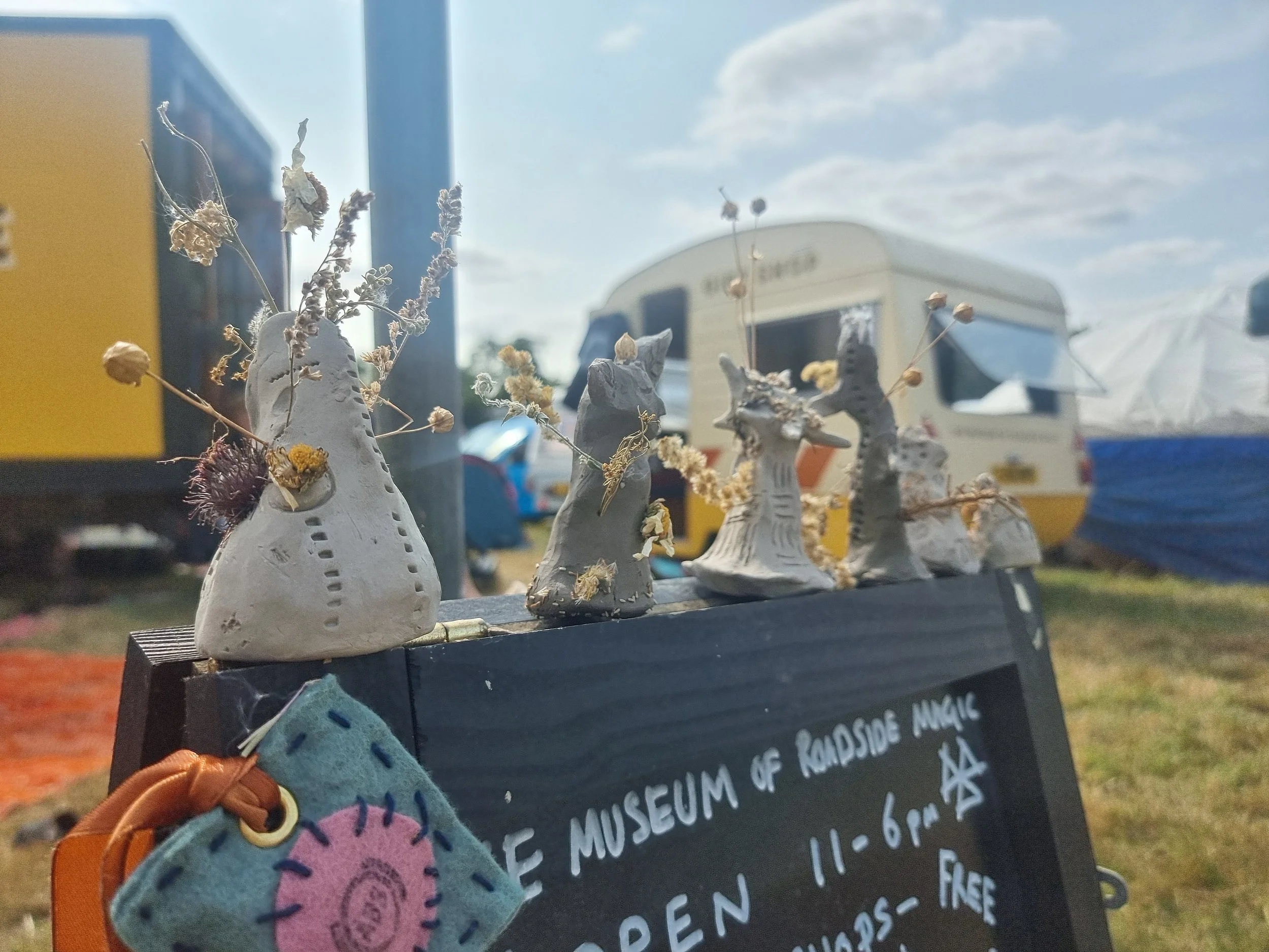  (Workshop example ) Raw Clay charms - folkeast festival 2024. 

During the project I will run, raw clay mini mask making using natural dried flowers and wildflower seeds - learning about vergeside plantlore and building tactile skills. (6-9 yrs) 