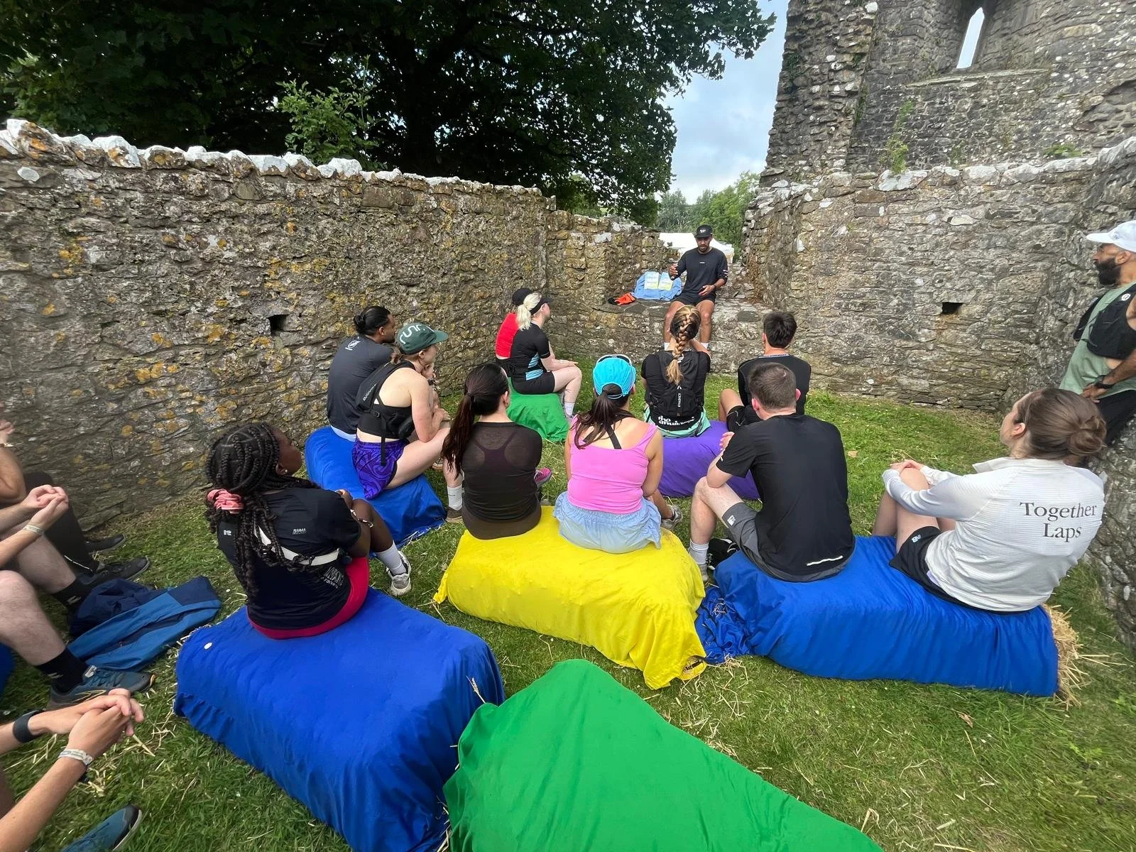 Raziq Rauf talking about Running and Creativity in a workshop in Wales at the Love Trails Festival