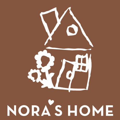 Children's drawing of a house with a tree and the words 'Nora's Home' underneath.
