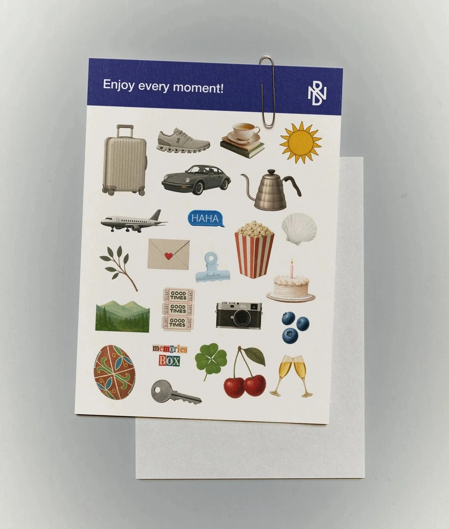 A collage of various travel-related stickers, including a suitcase, sneaker, coffee cup, sun, car, airplane, laughing speech bubble, kettle, envelope with a heart, popcorn, shell, cake with a candle, mountain landscape, tickets, camera, blueberries, decorated egg, key, and cherries, on a white background with a blue header reading "Enjoy every moment!".