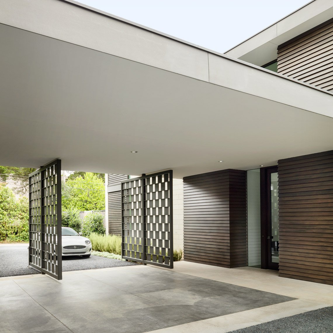 architect company preston hollow drive up with car