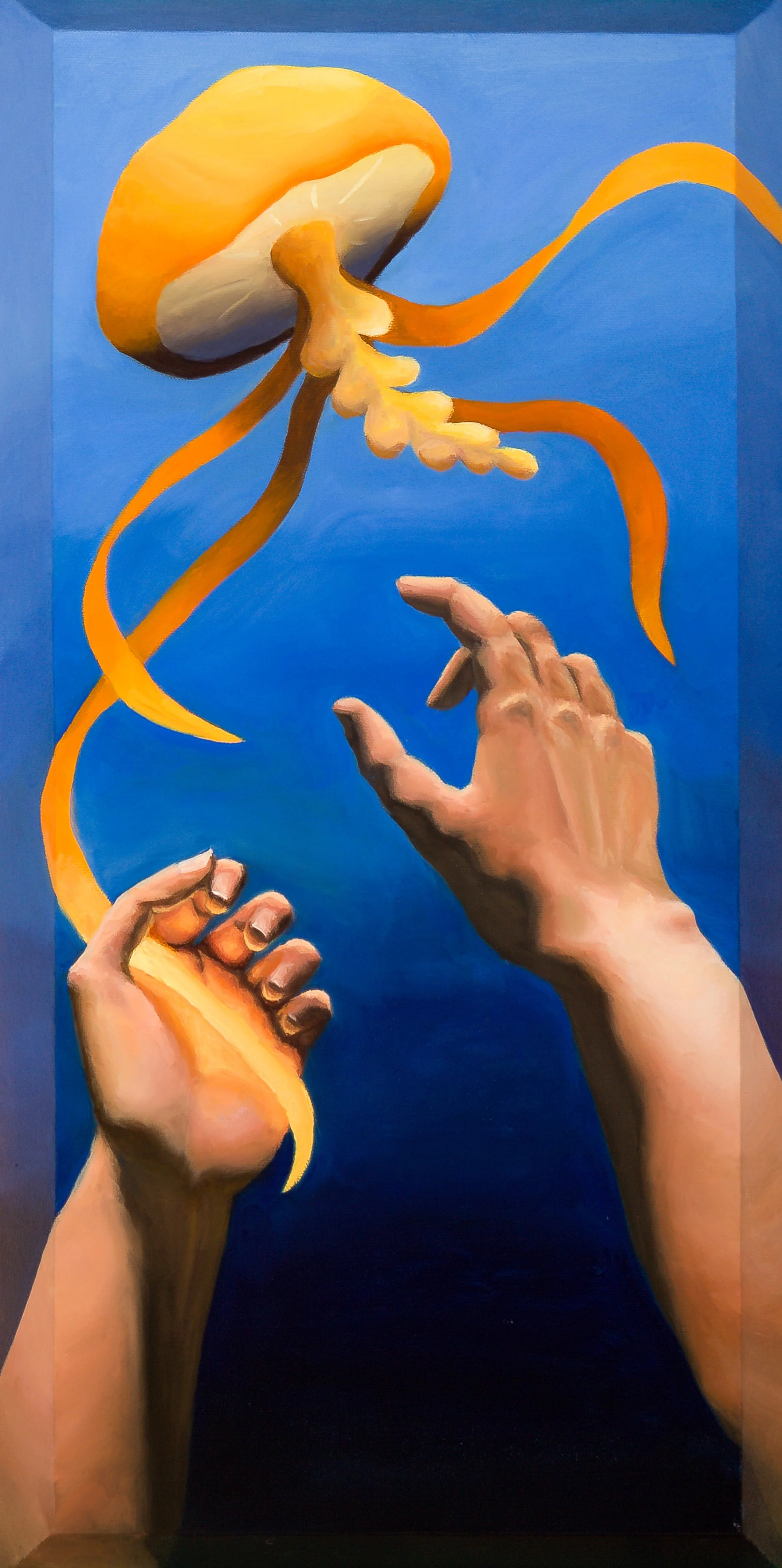 Two arms underwater reaching up towards a bright yellow jellyfish.