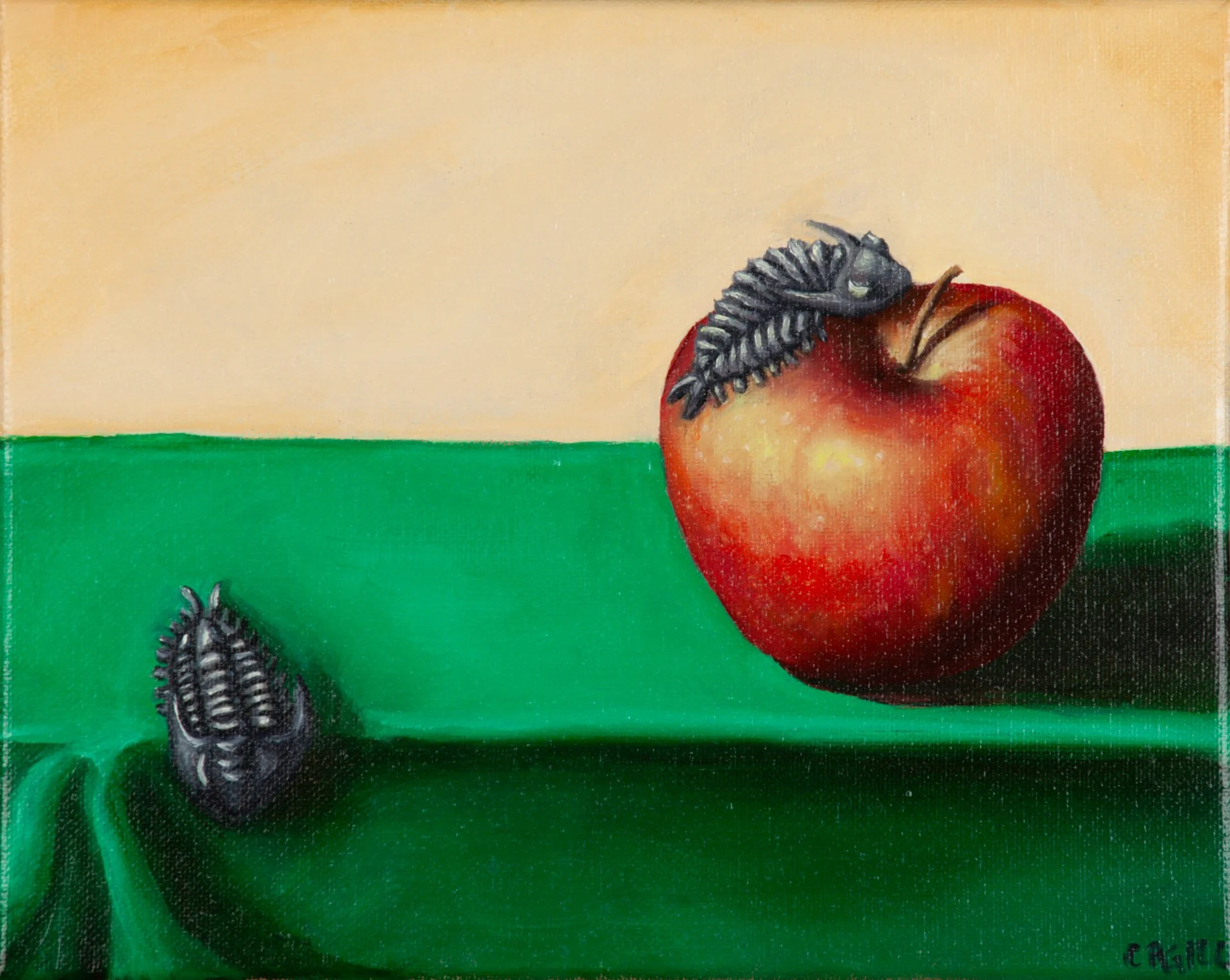 Fantasy painting of a real life apple on a green tabletop with a trilobite crawling on it and another trilobite crawling off the table.