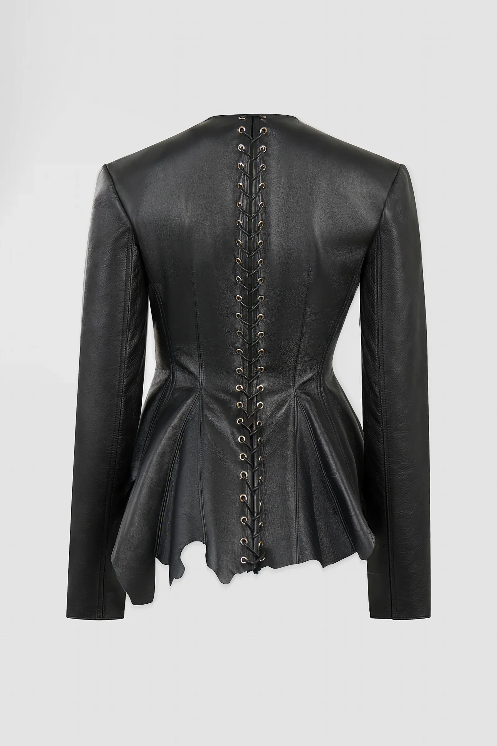 Back: Back view of ARAKHNE's ‘Euryale’ black leather jacket featuring full-length corset lacing, metal eyelets and an asymmetric raw-cut peplum.