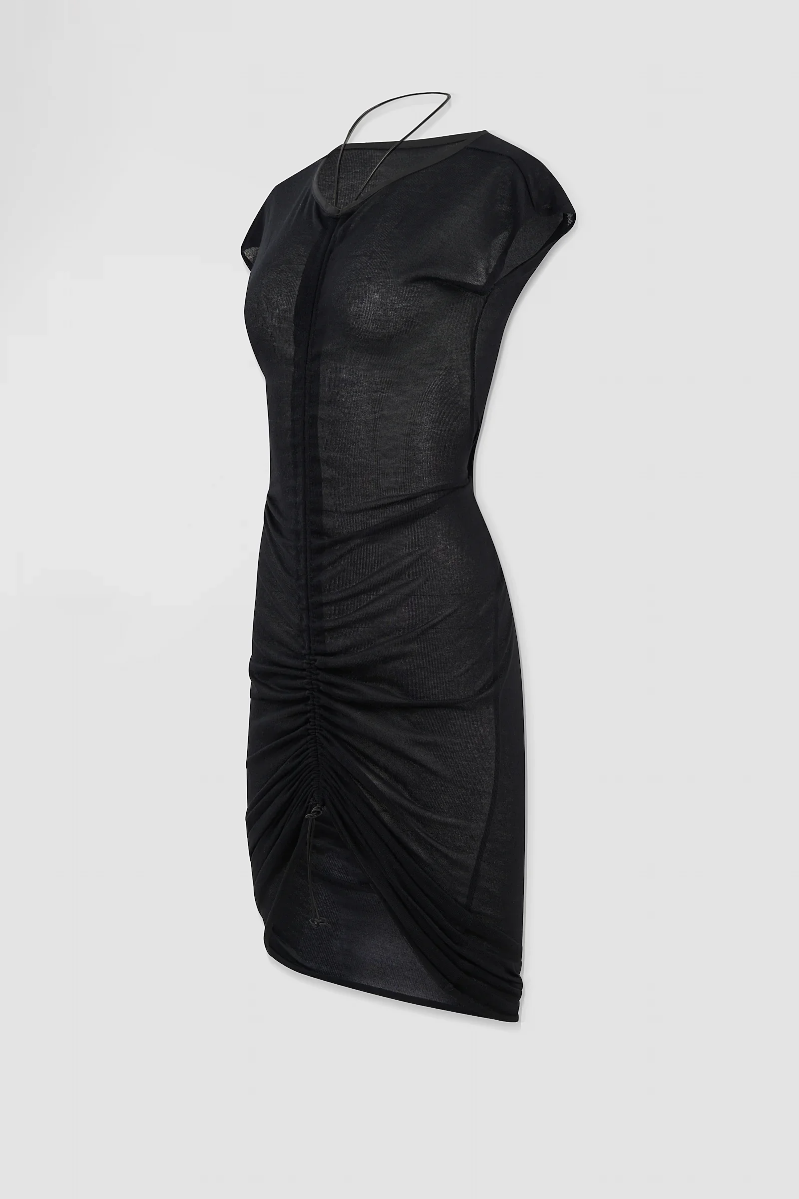 Three-quarter: Angled view of the ‘Medusa’ semi-sheer black dress showing its body-contouring silhouette and adjustable halterneck styling.