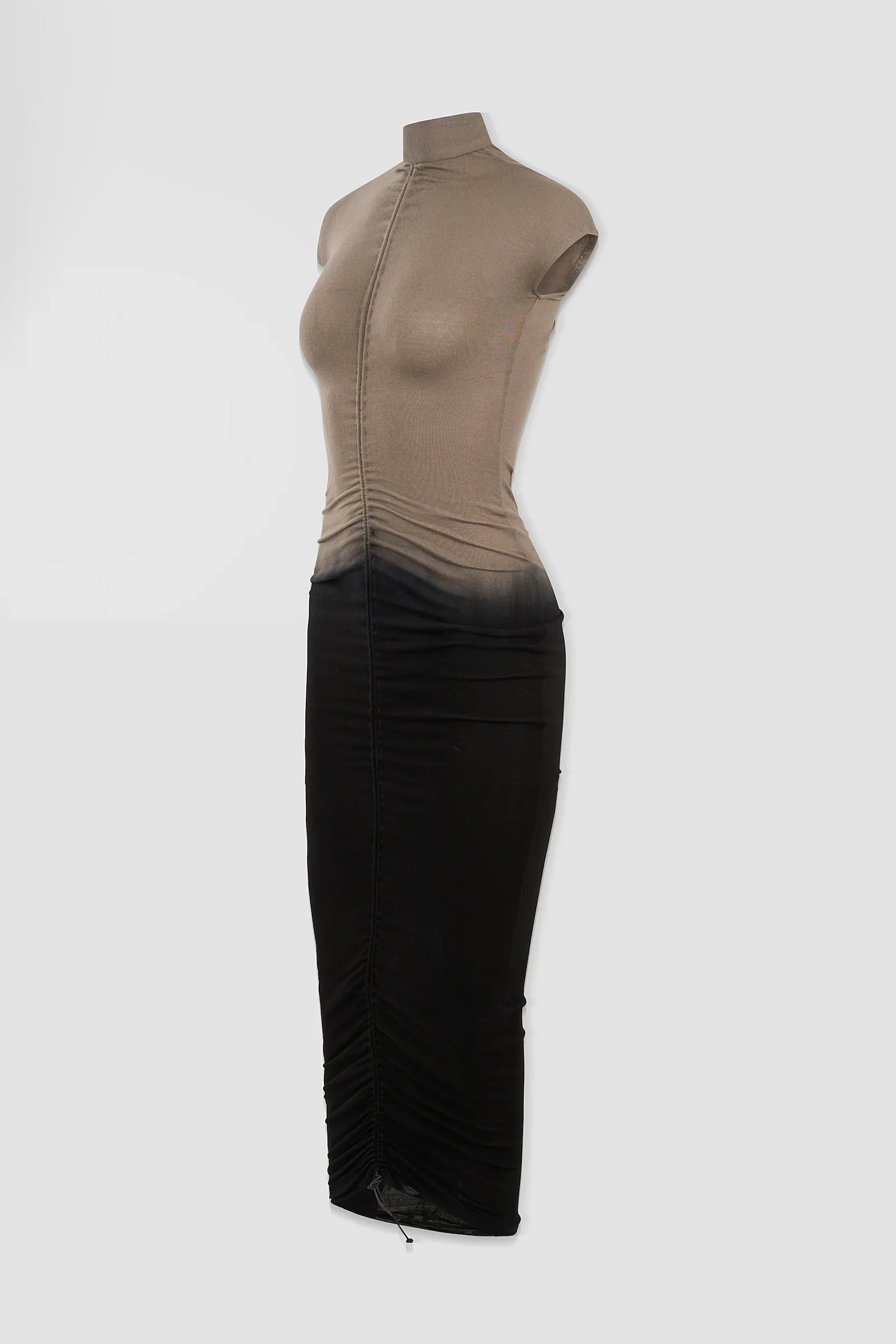 Three-quarter: Angled view of the ‘Medusa’ high-neck maxi dress showing its elongated silhouette and graduated colour finish.