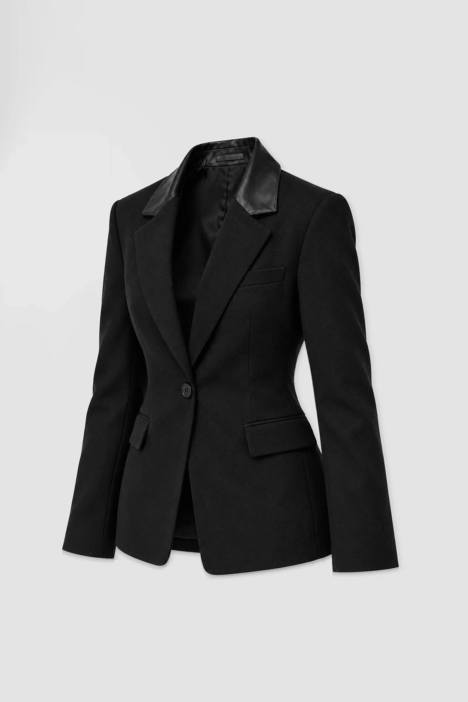 Back: Back view of ARAKHNE's black sculpted blazer featuring contoured tailoring seams, structured shoulders and contrasting leather collar.