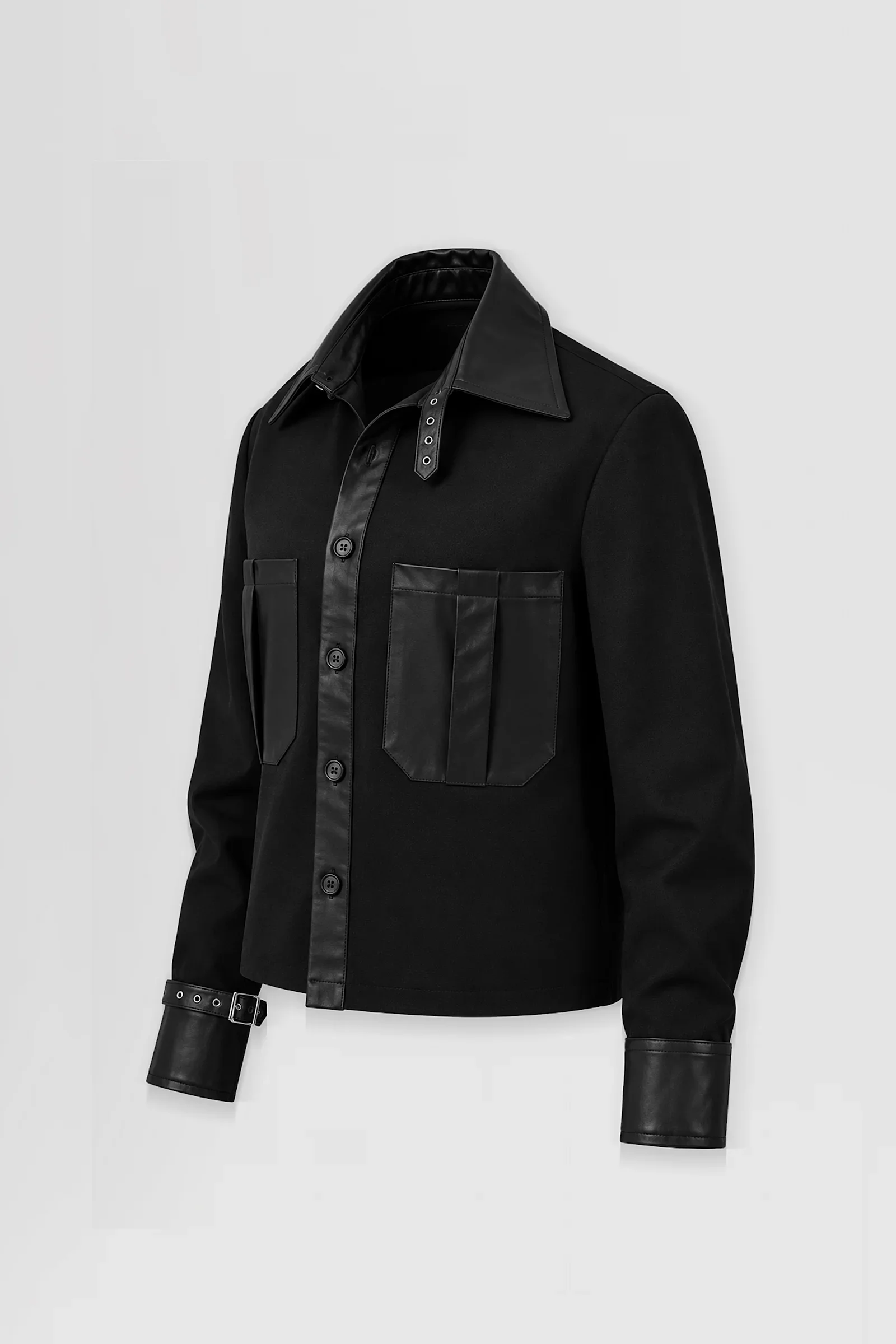 Three-quarter: Three-quarter view of the Stheno black leather-trimmed overshirt showing its pointed collar, asymmetric patch pockets and buckle cuff detailing.
